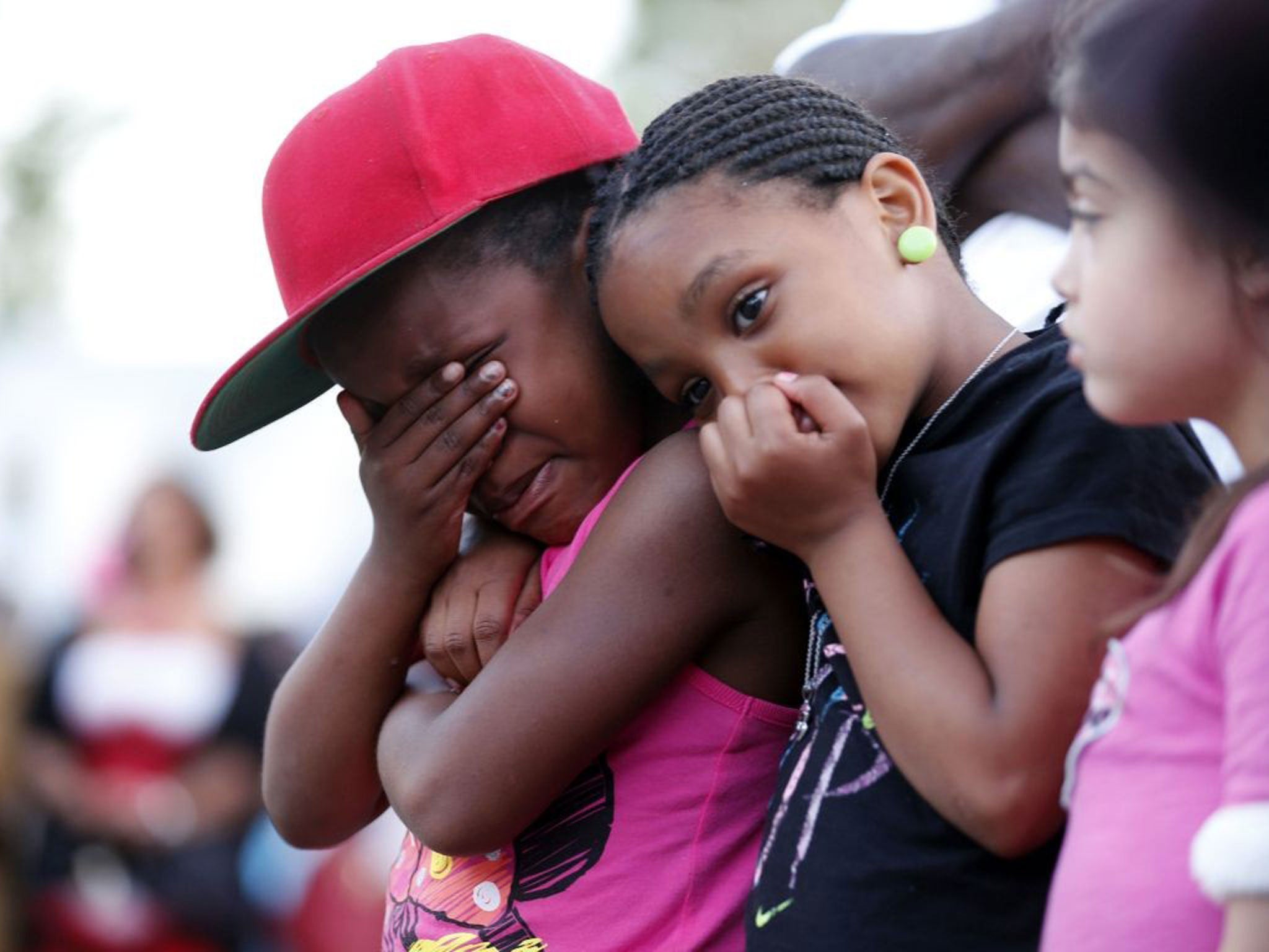 Children cry during a prayer vigil for Martin Cobb (AP)