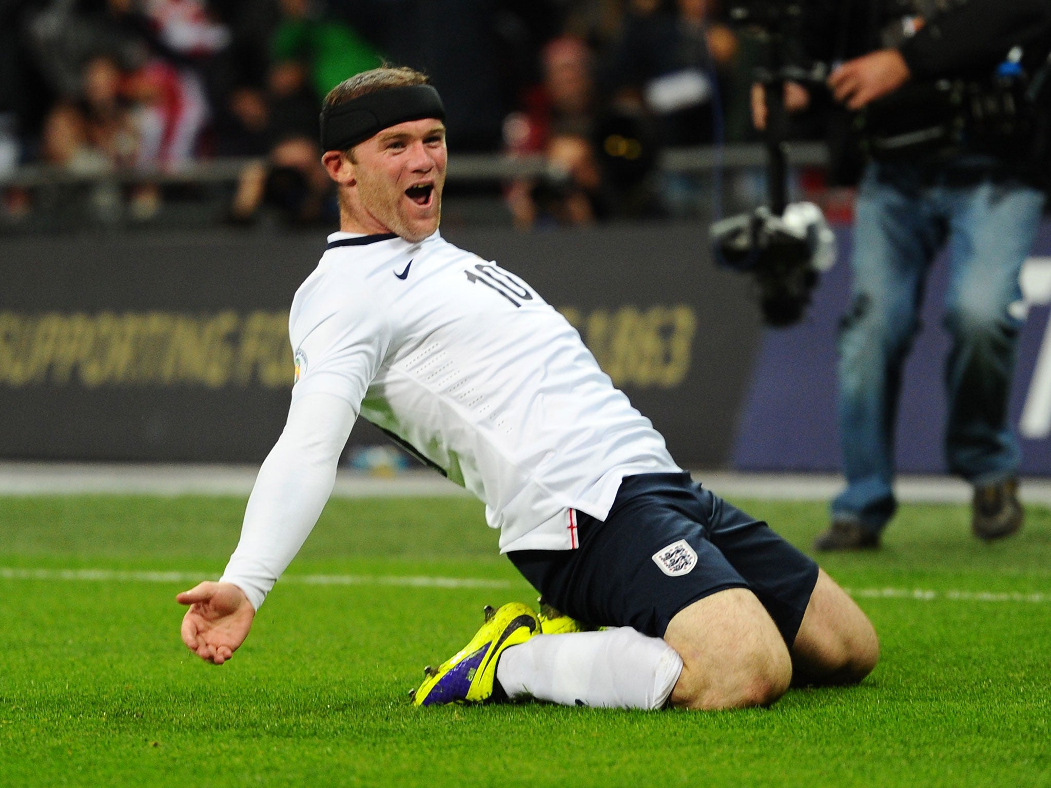 Wayne Rooney celebrates his goal against Montenegro in England's World Cup qualifier