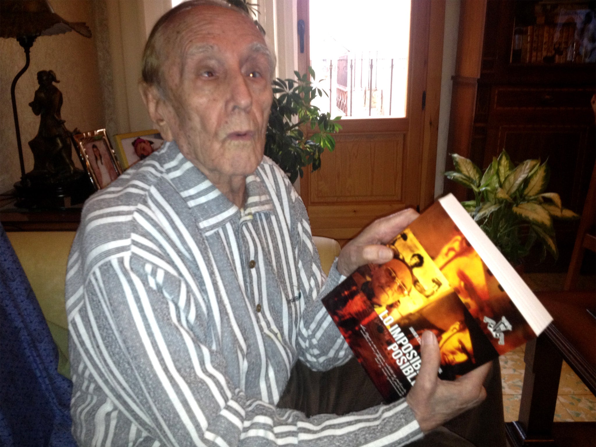 Javier Escarceller, sitting in his niece’s living room in Caseres