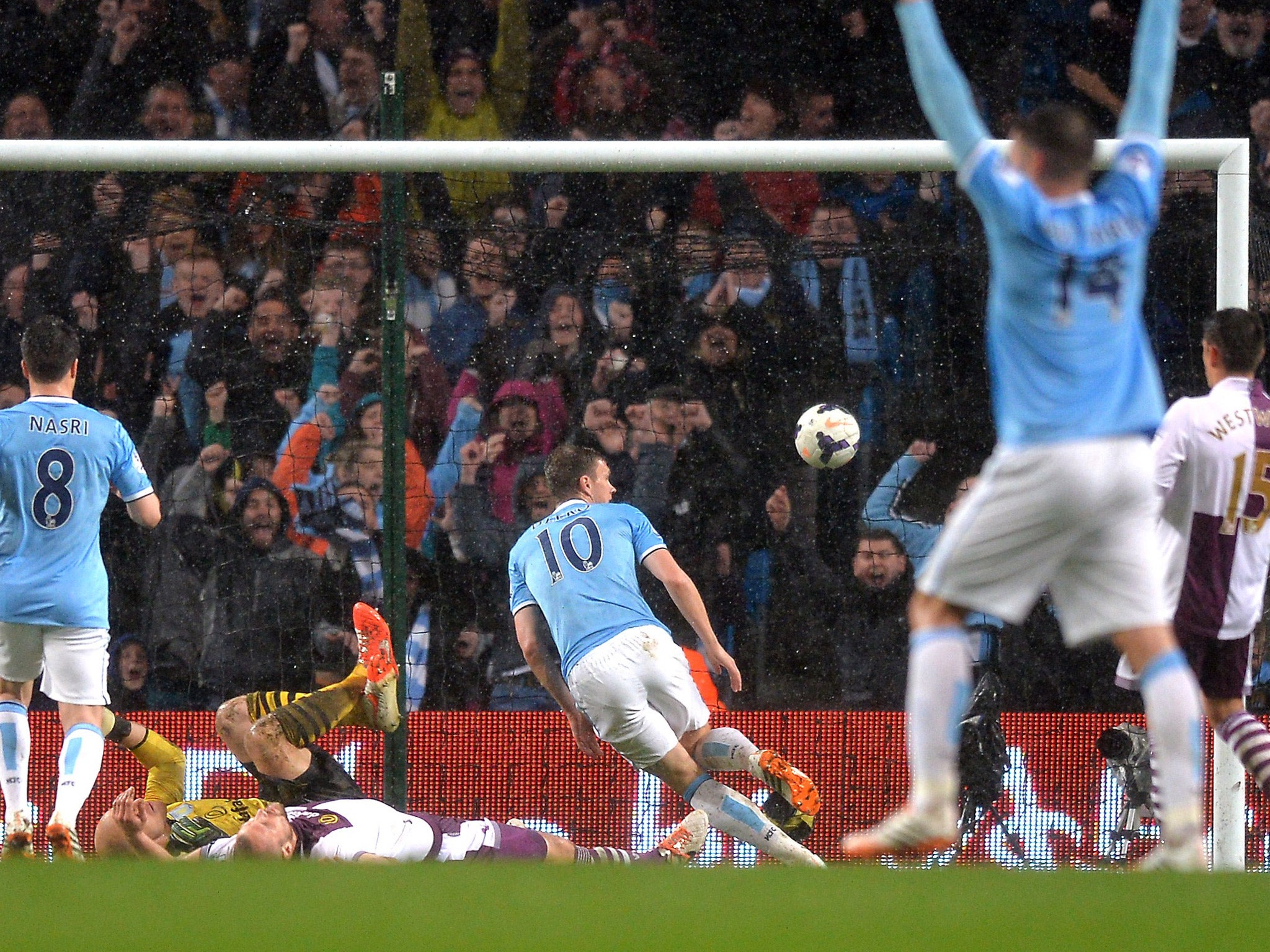 Edin Dzeko directs Pablo Zabaleta's cross into the Villa goal to give City the lead (Getty)