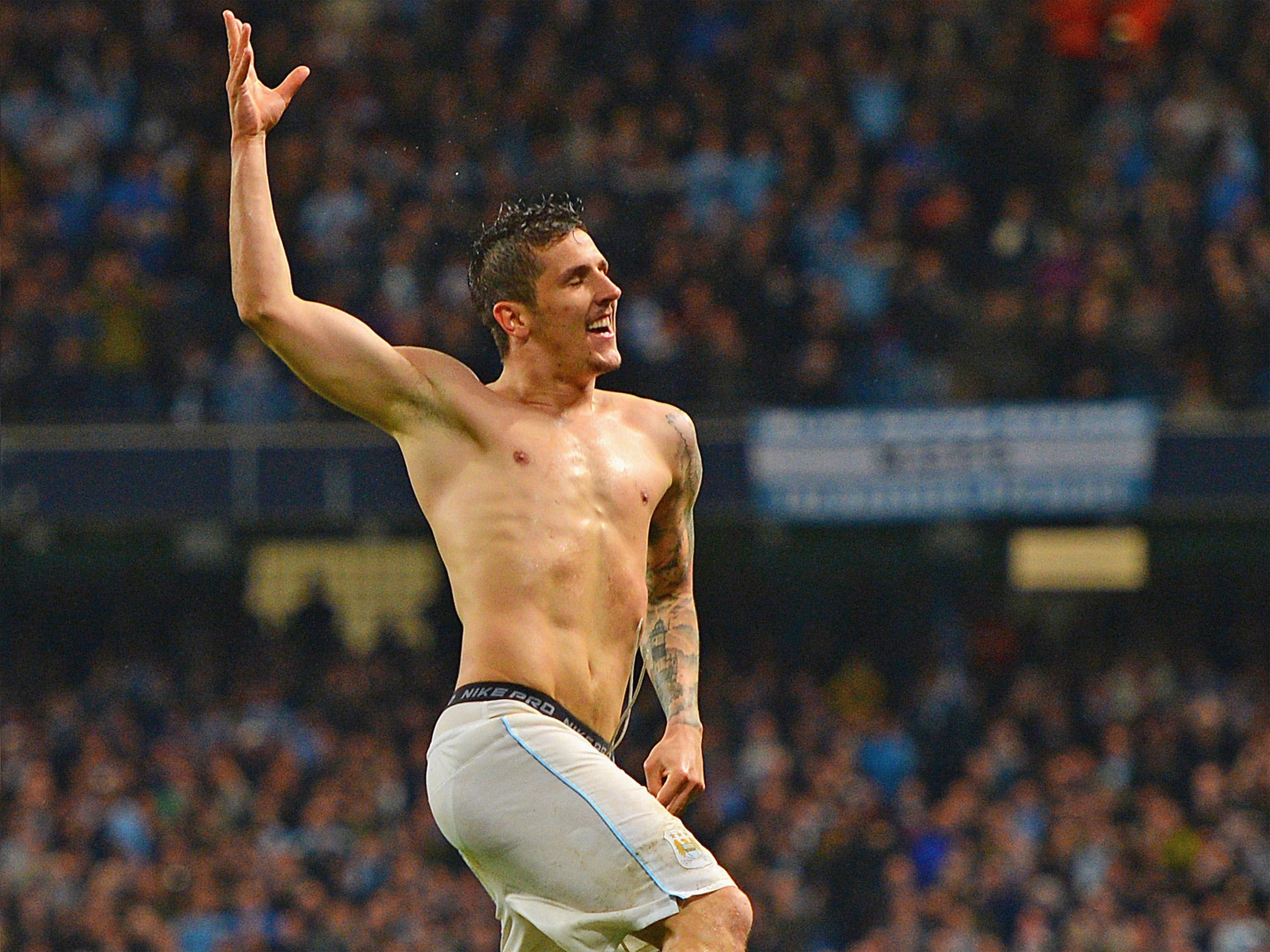 A shirtless Stevan Jovetic celebrates scoring City's third (Getty)