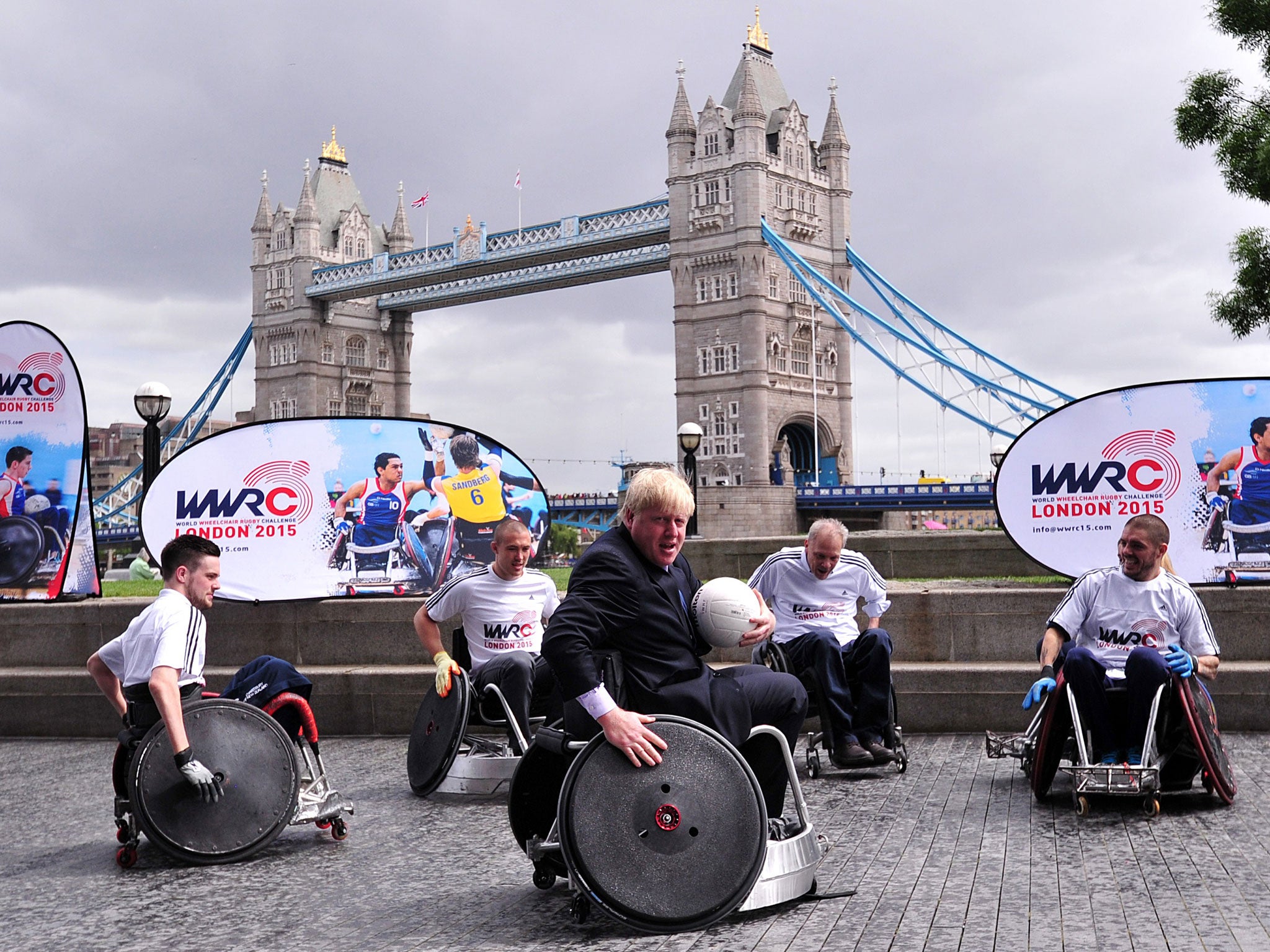 Mayor of London Boris Johnson (C) takes part in wheelchair rugby demonstration in central London to officially launch the World Wheelchair Rugby Challenge which will take place in October 2015 in the Copper Box Arena at Queen Elizabeth Olympic Park in eas