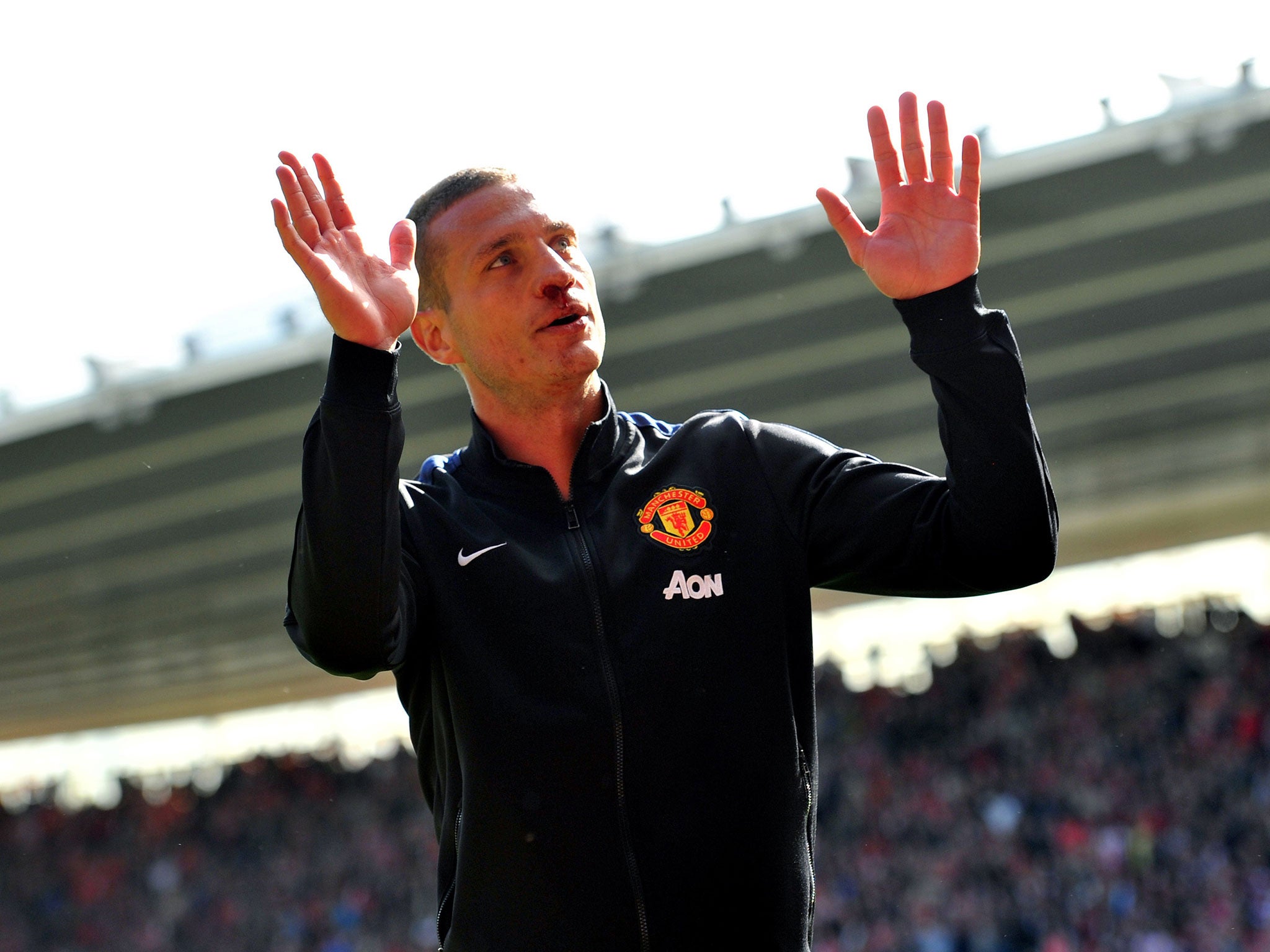 A bloodied Nemanja Vidic says thank you to the United fans after his last game for the club at Southampton