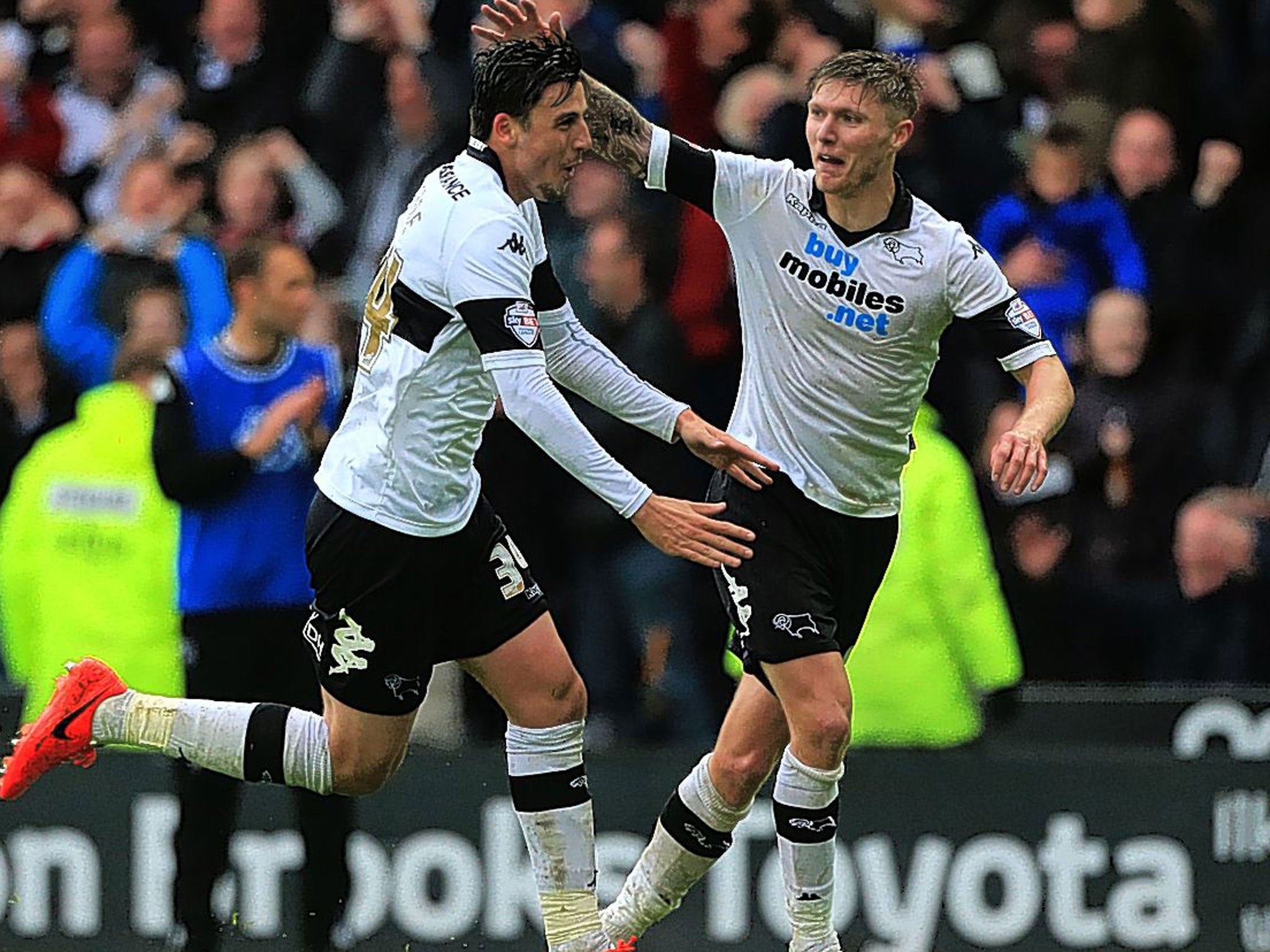 Midfielder George Thorne is congratulated by Jeff Hendrick after scoring Derby County’s third goal