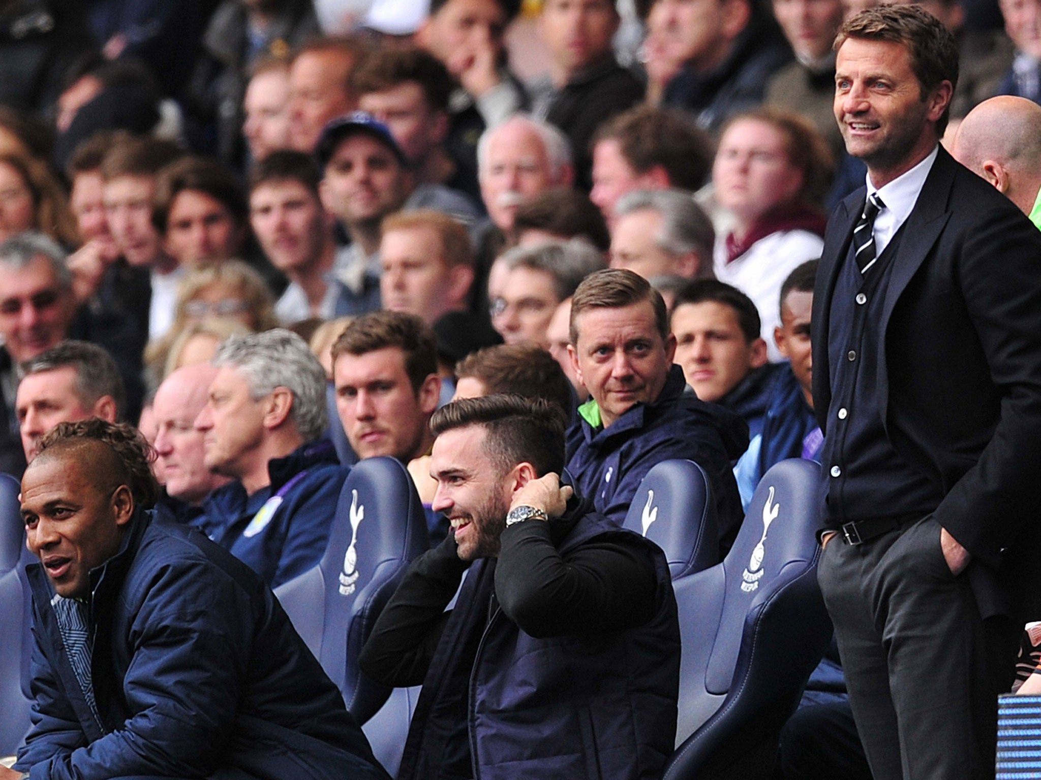 Tim Sherwood (right) with the supporter sitting in the dugout