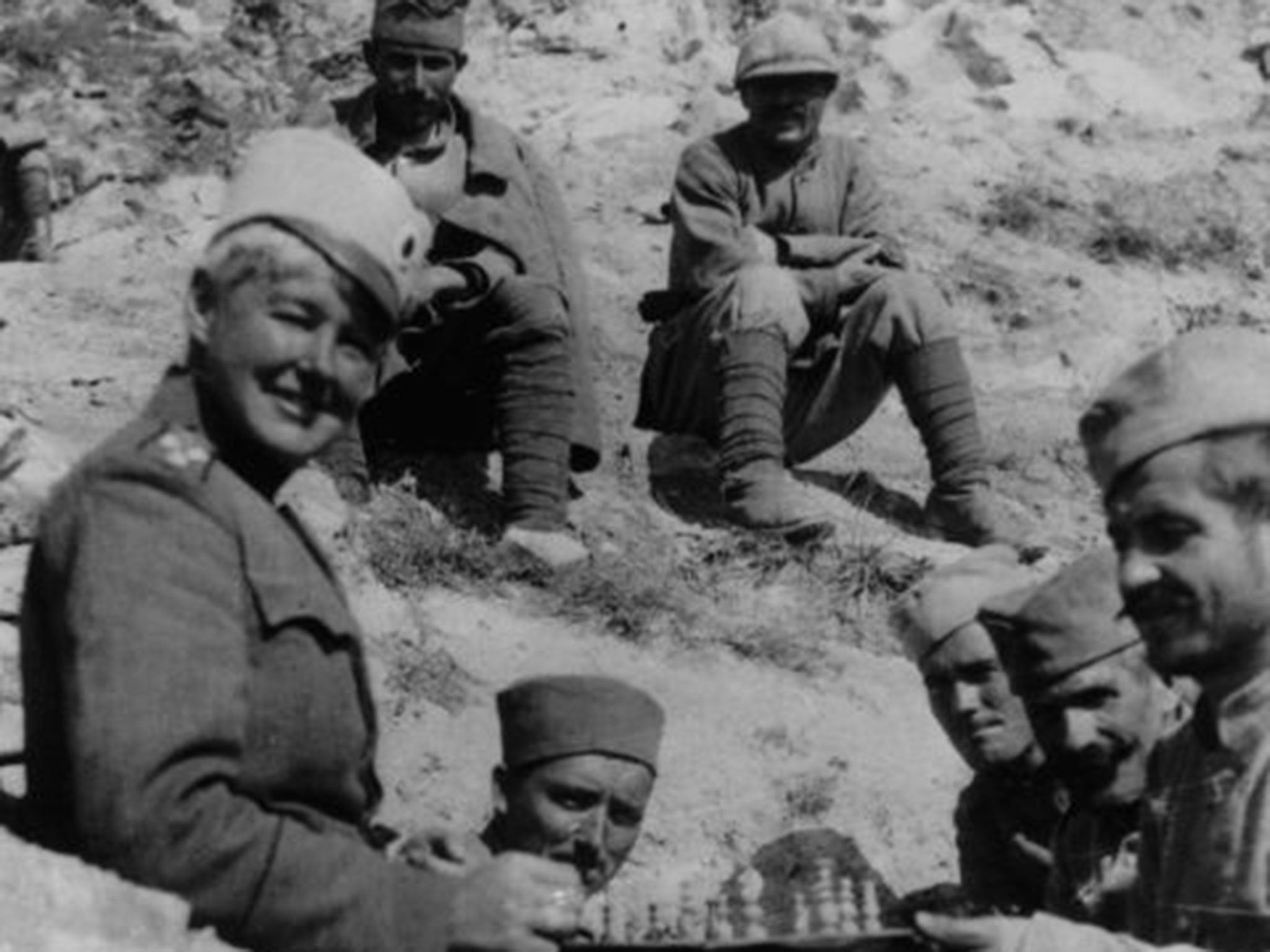 Flora Sandes, who rose from private to sergeant-major in the Serbian army, playing chess with her Serbian comrades. After the war ended, she was promoted to lieutenant