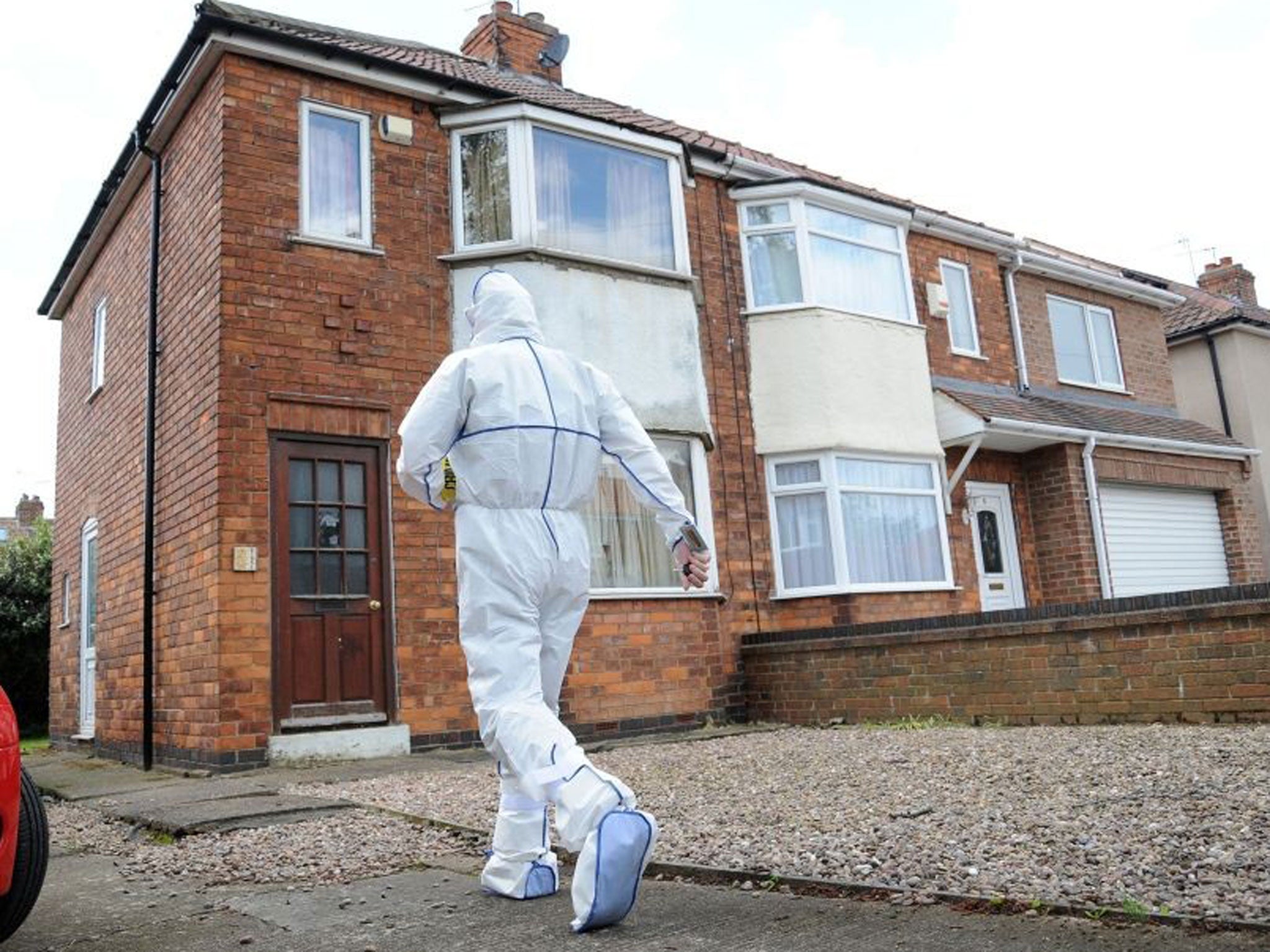 A forensic officer outside a house in Burnholme Grove, York