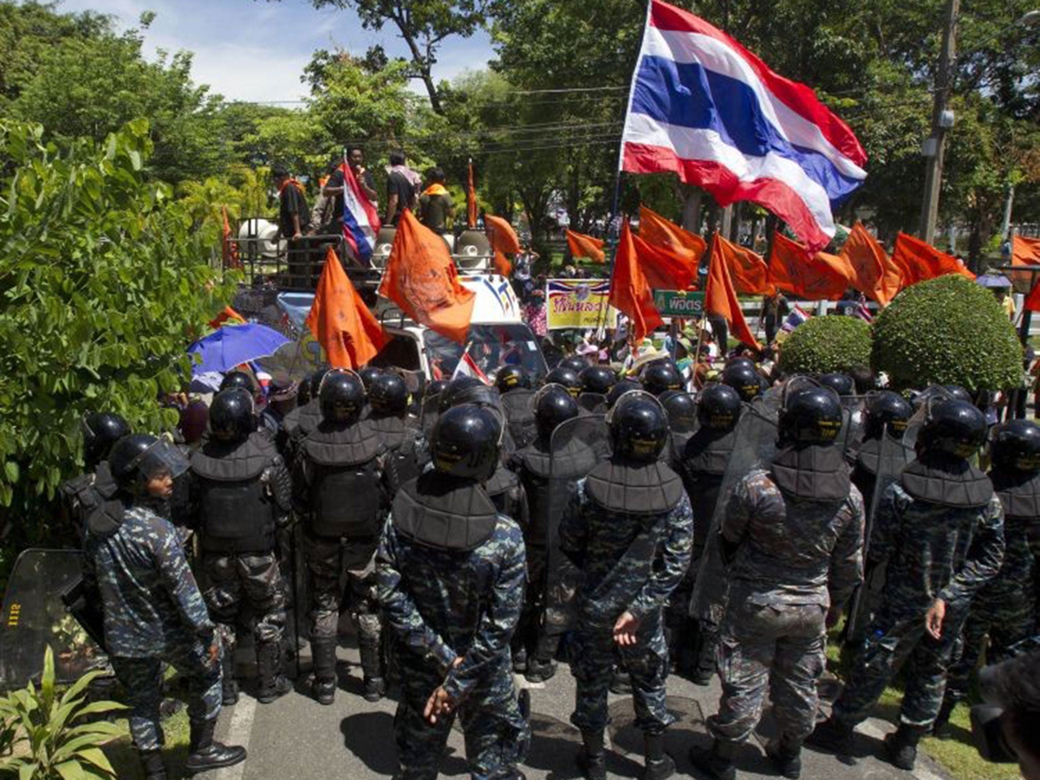 Military policemen gather to block anti-government protesters from entering the hall of the air force academy compound in Bangkok where the meeting was taking place