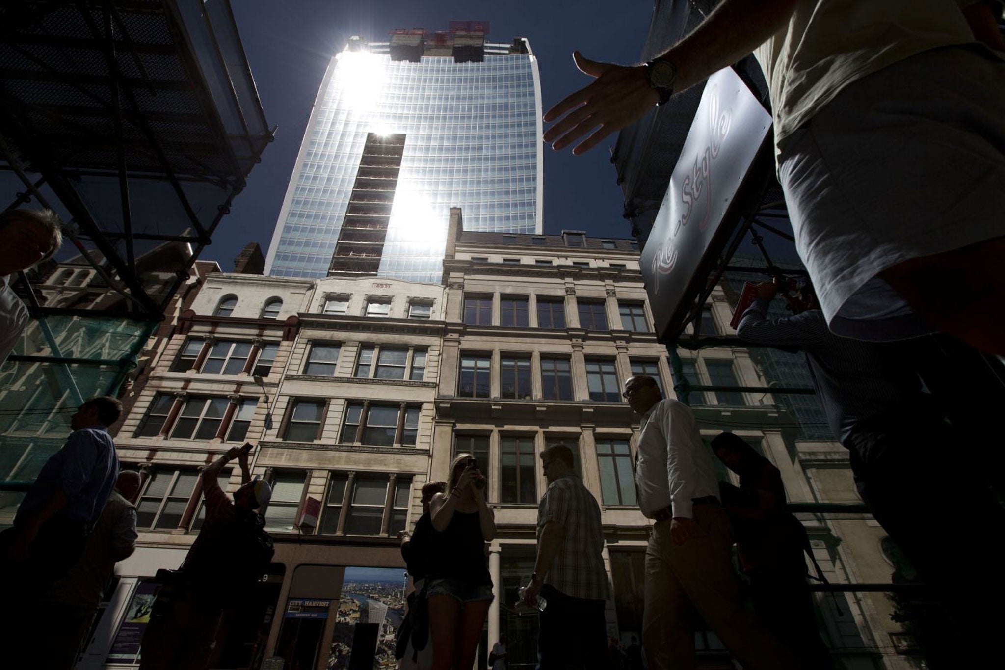 Intense sunlight reflects down towards street level off the 37-storey skyscraper at 20 Fenchurch Street in the City of London