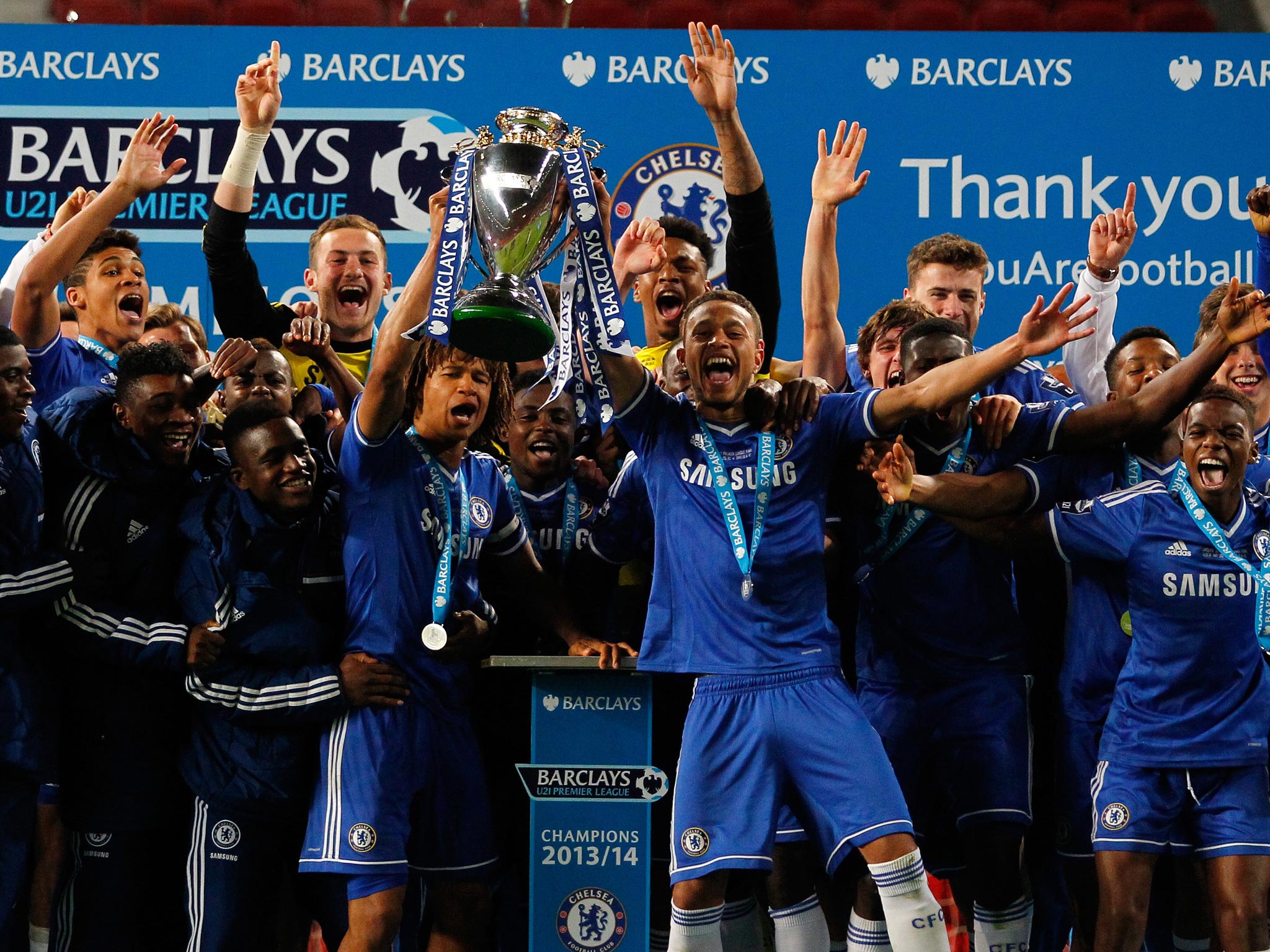 Chelsea players celebrate with the Under-21 Premier
League trophy after their play-off final win at Old Trafford