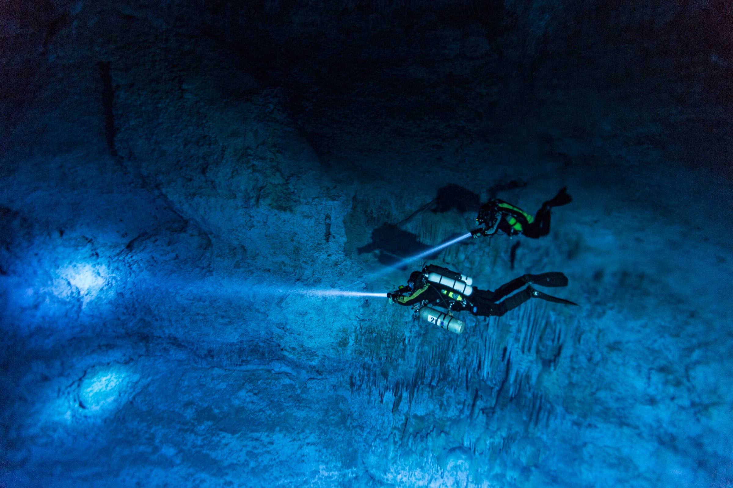 Divers Susan Bird and Alberto Nava search the walls of Hoyo Negro, an underwater cave on Mexico’s Yucatán Peninsula where the remains of Naia were found.