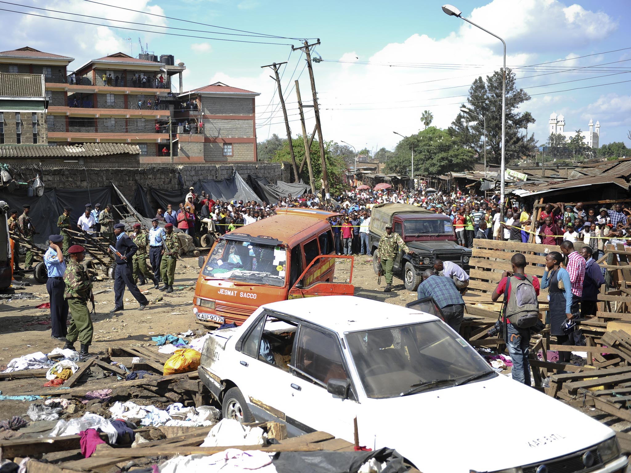 Security forces seal off the market site where two
blasts killed at least 10 and left 70 injured yesterday