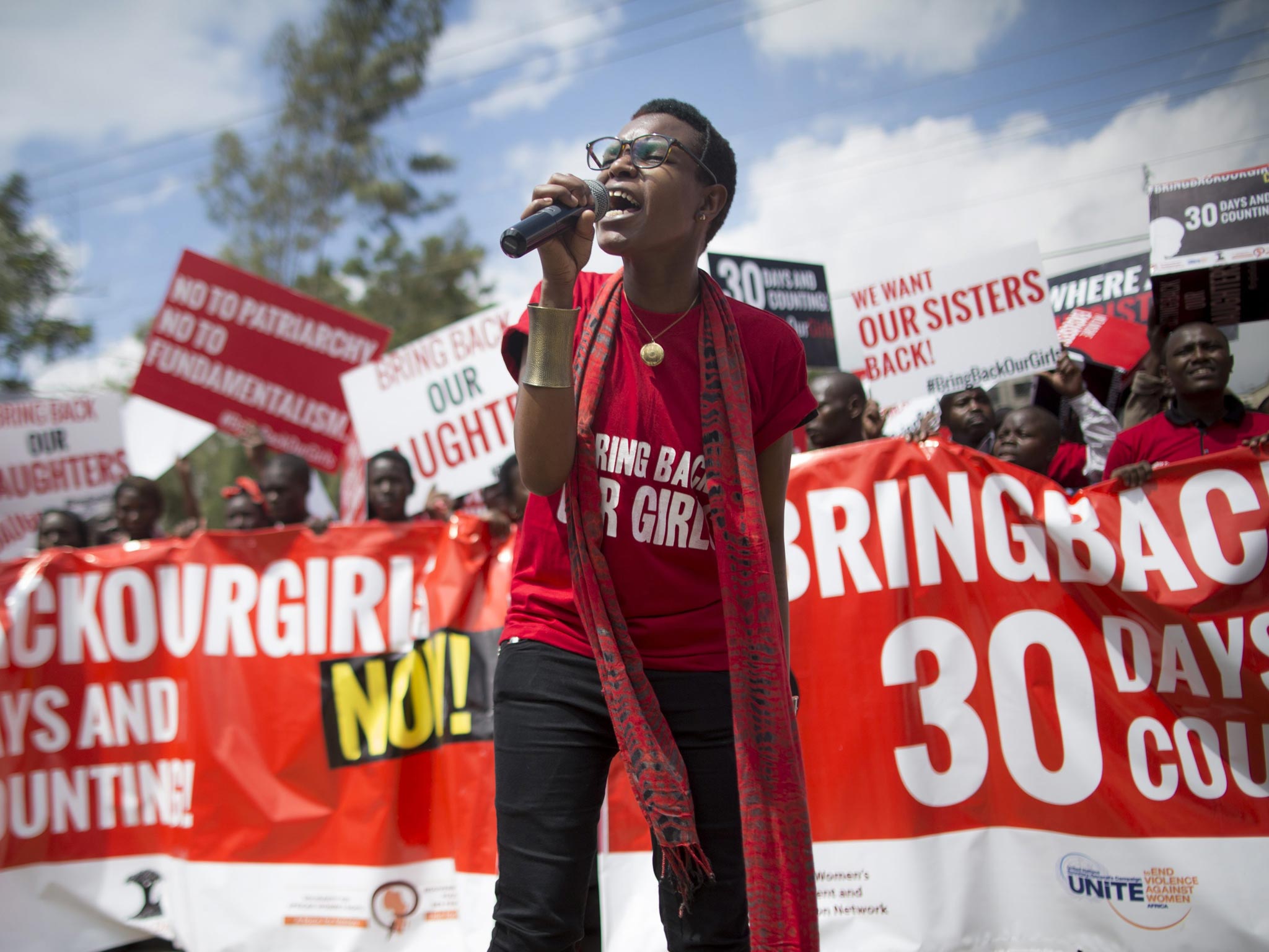 Kenyan activists shout slogans during a demonstration to protest against kidnapping of Nigerian school girls