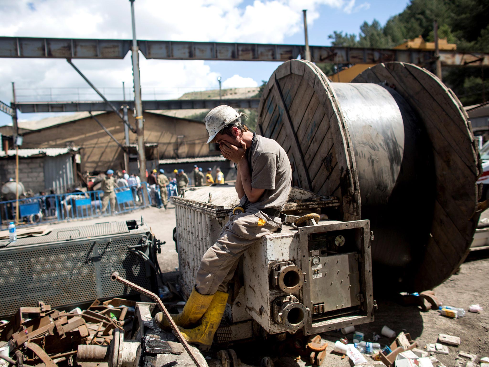 A miner waits anxiously at the pit entrance