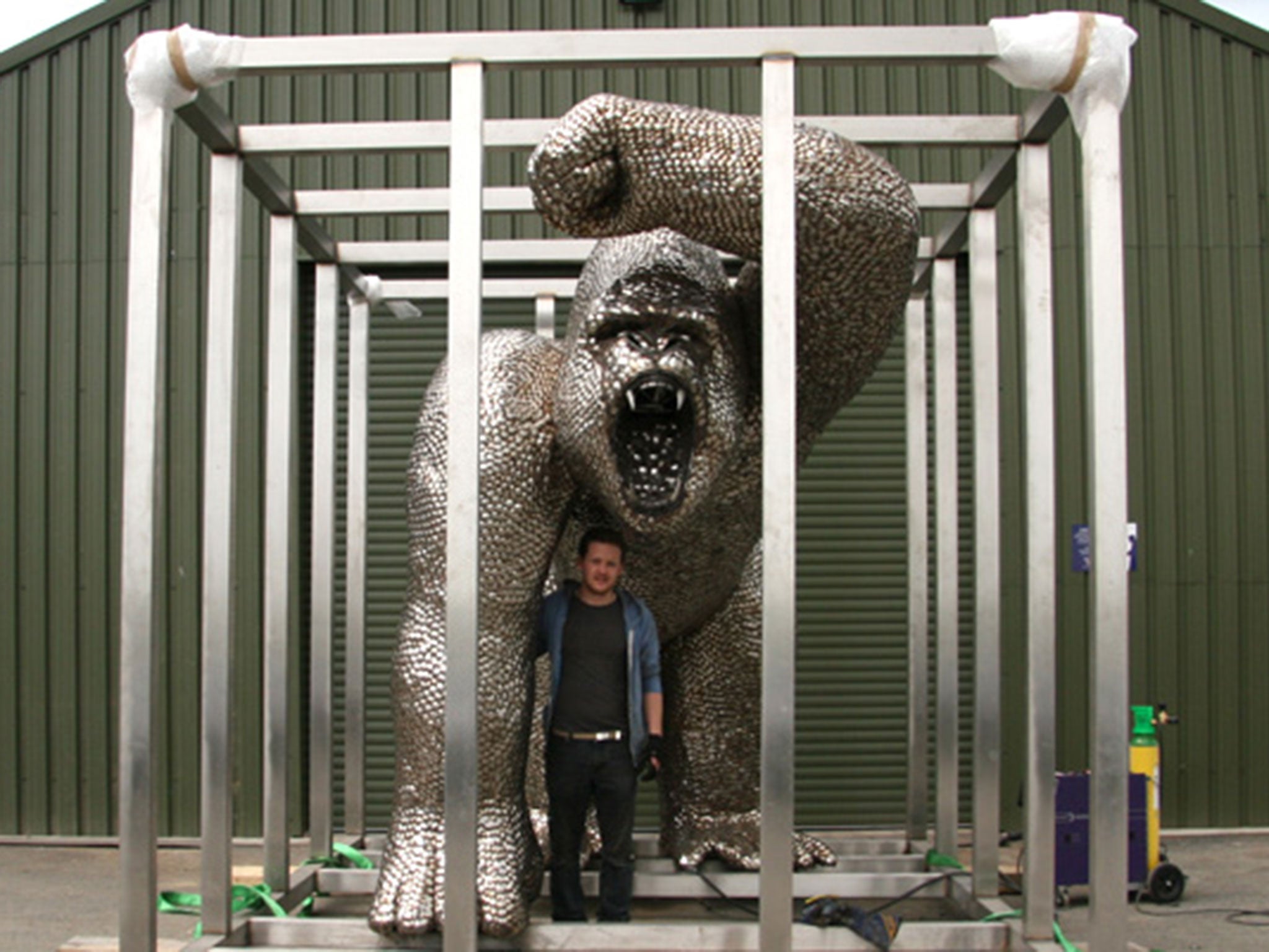 Sculptor Alfie Bradley with his creation