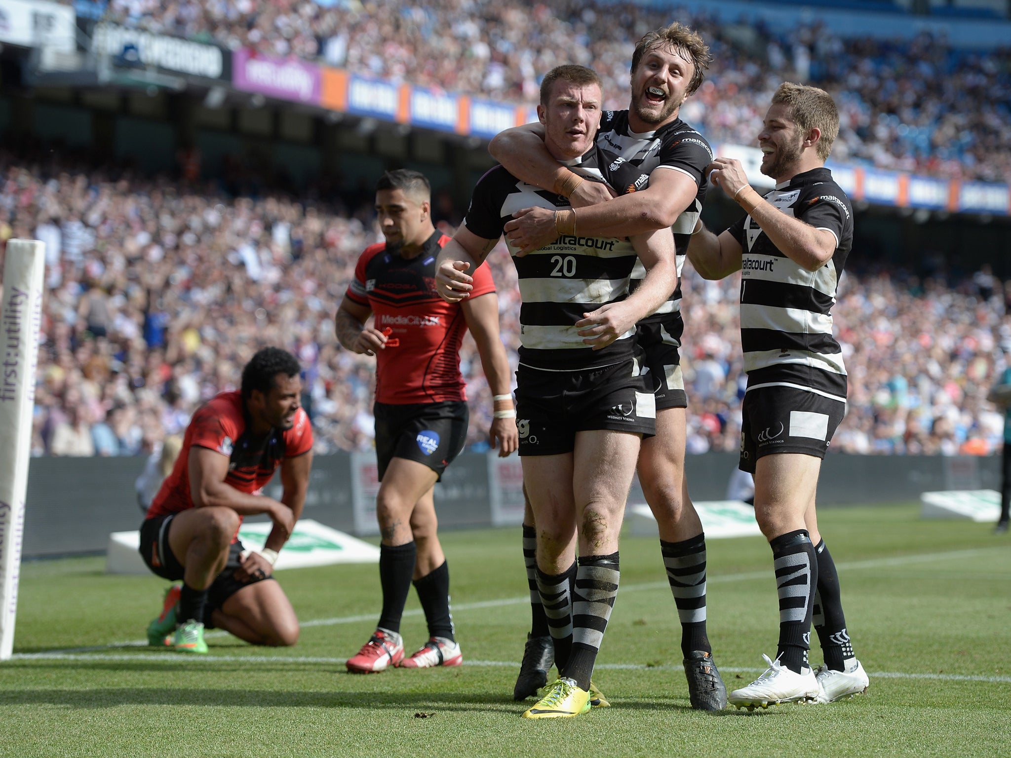 Paddy Flynn celebrates scoring the match-winning try against Salford