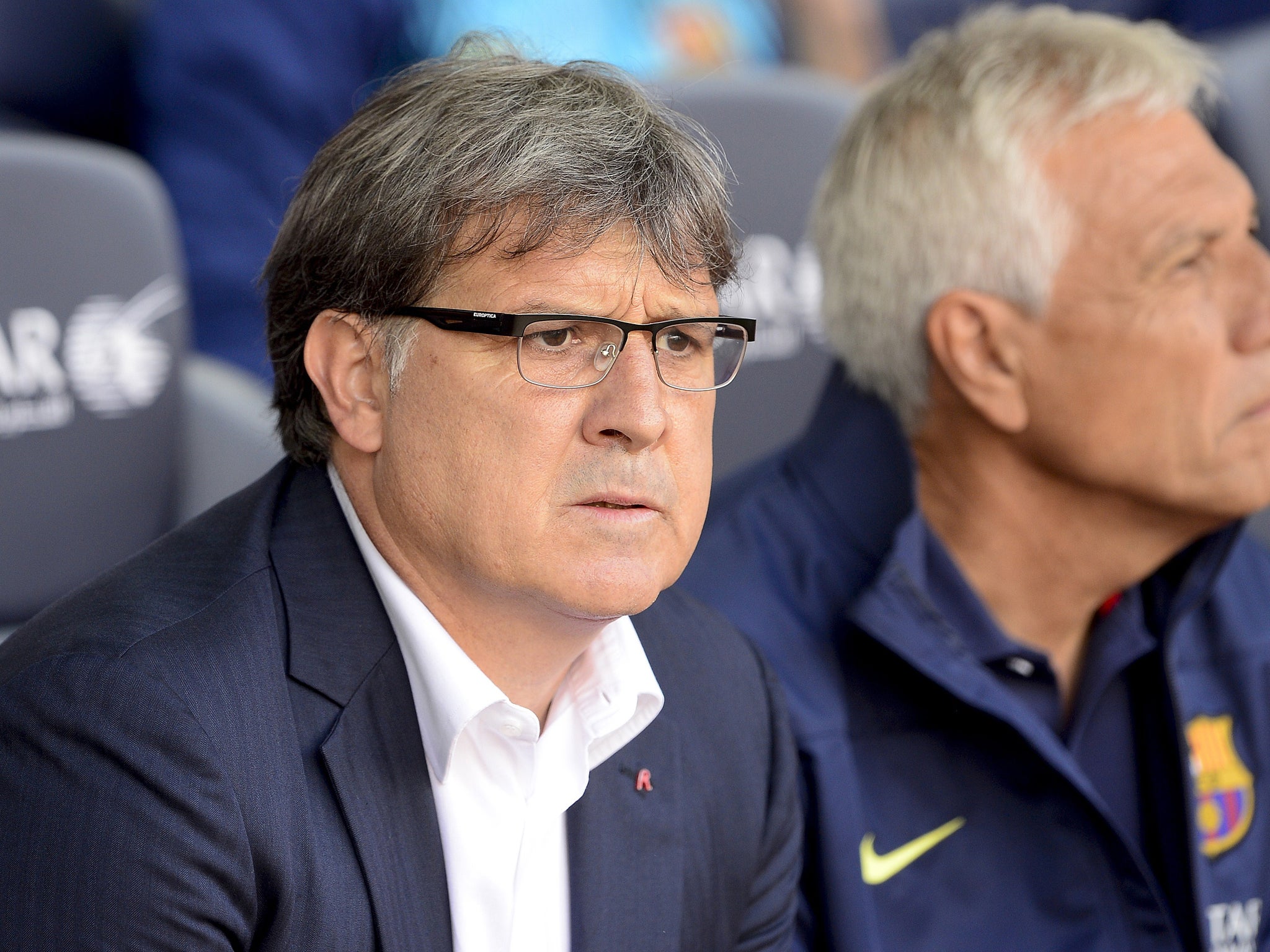 Barcelona's Argentinian coach Gerardo 'Tata' Martino looks on during the Spanish league football match FC Barcelona vs Club Atletico de Madrid at the Camp Nou stadium in Barcelona