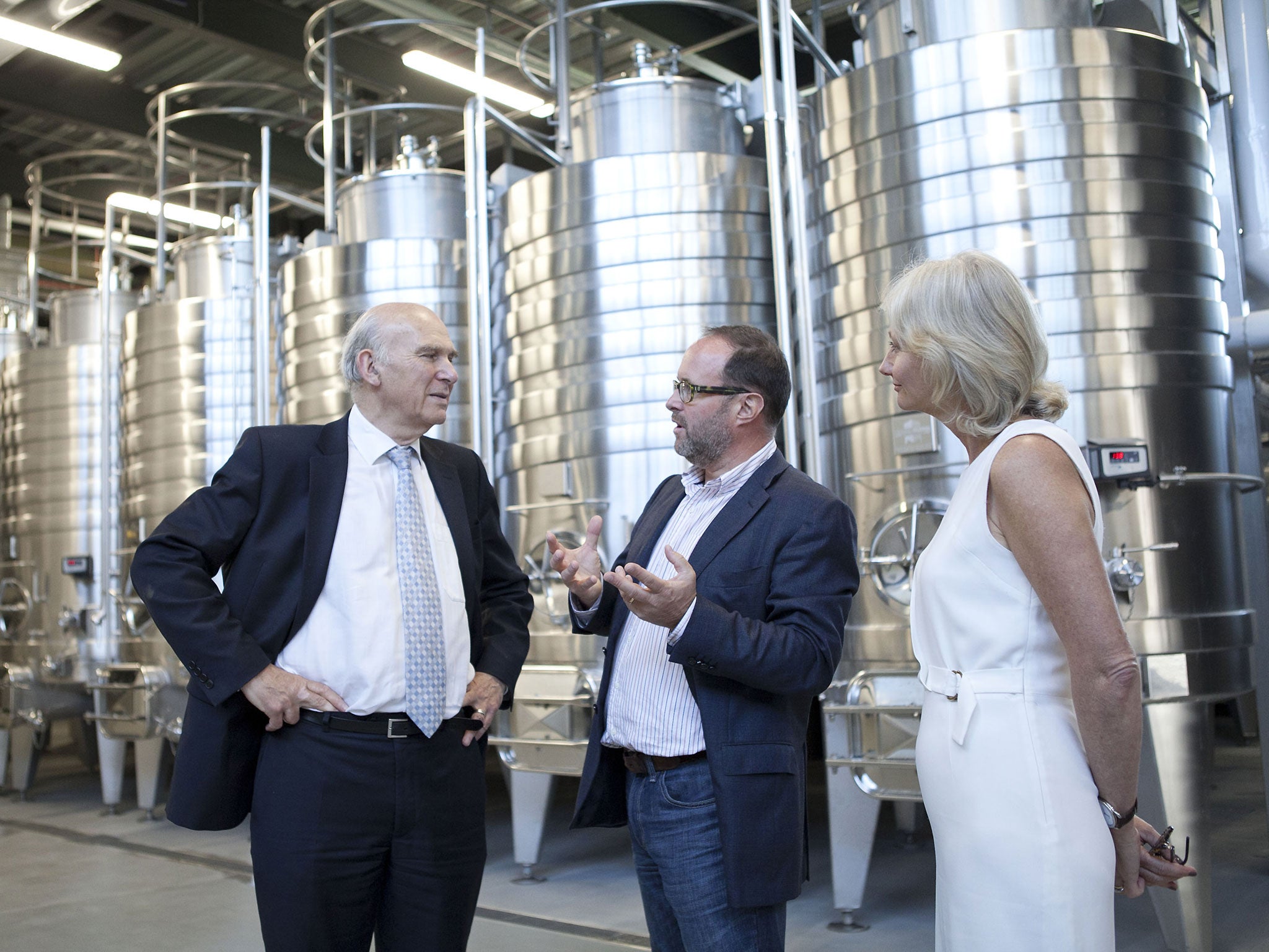 Mark Driver, centre, with his wife, Sarah, and Vince Cable at the launch