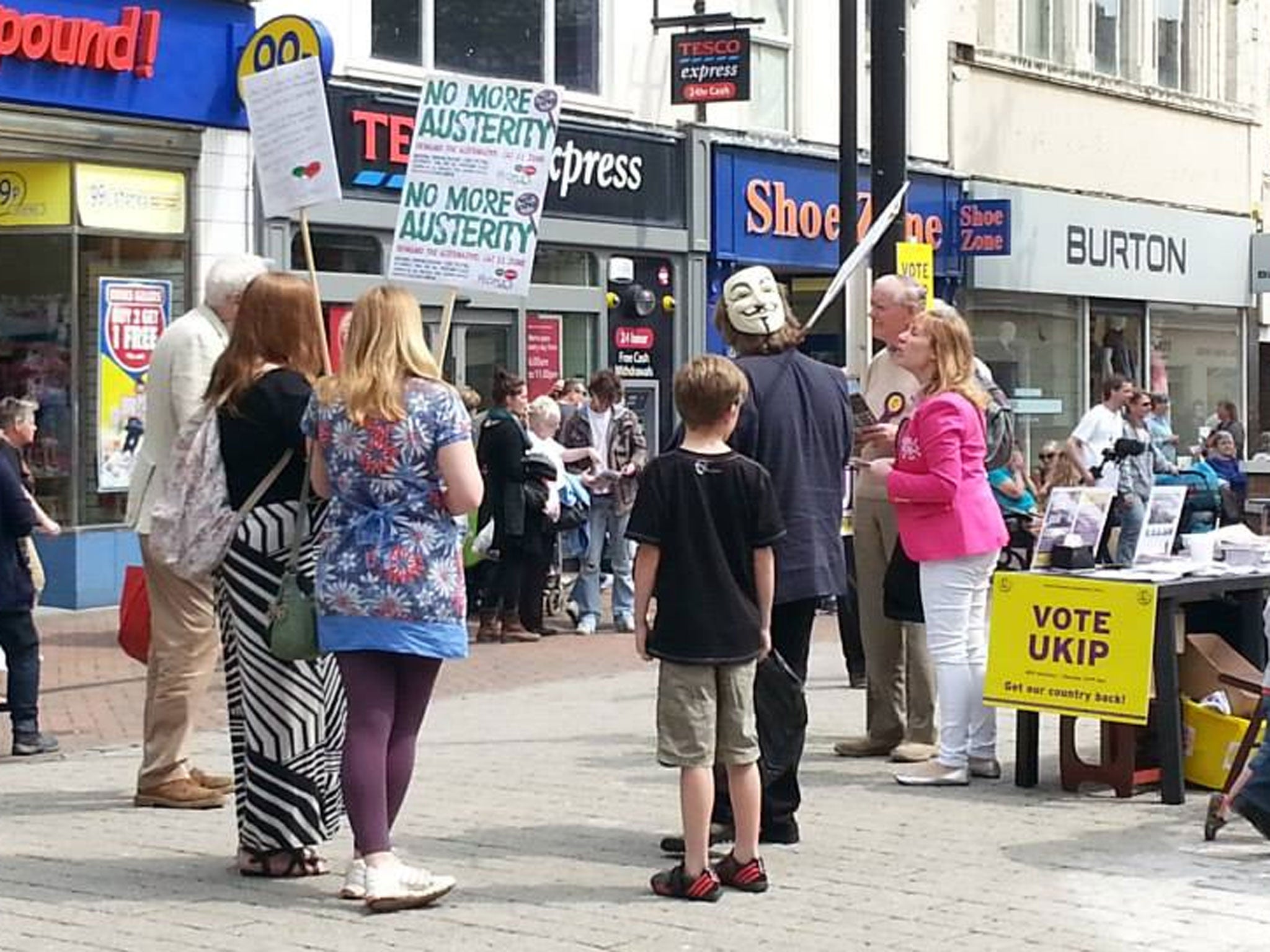 Members of the small group of People's Assembly activists said they stood 'peacefully' next to the Ukip stand and let members of the public approach them