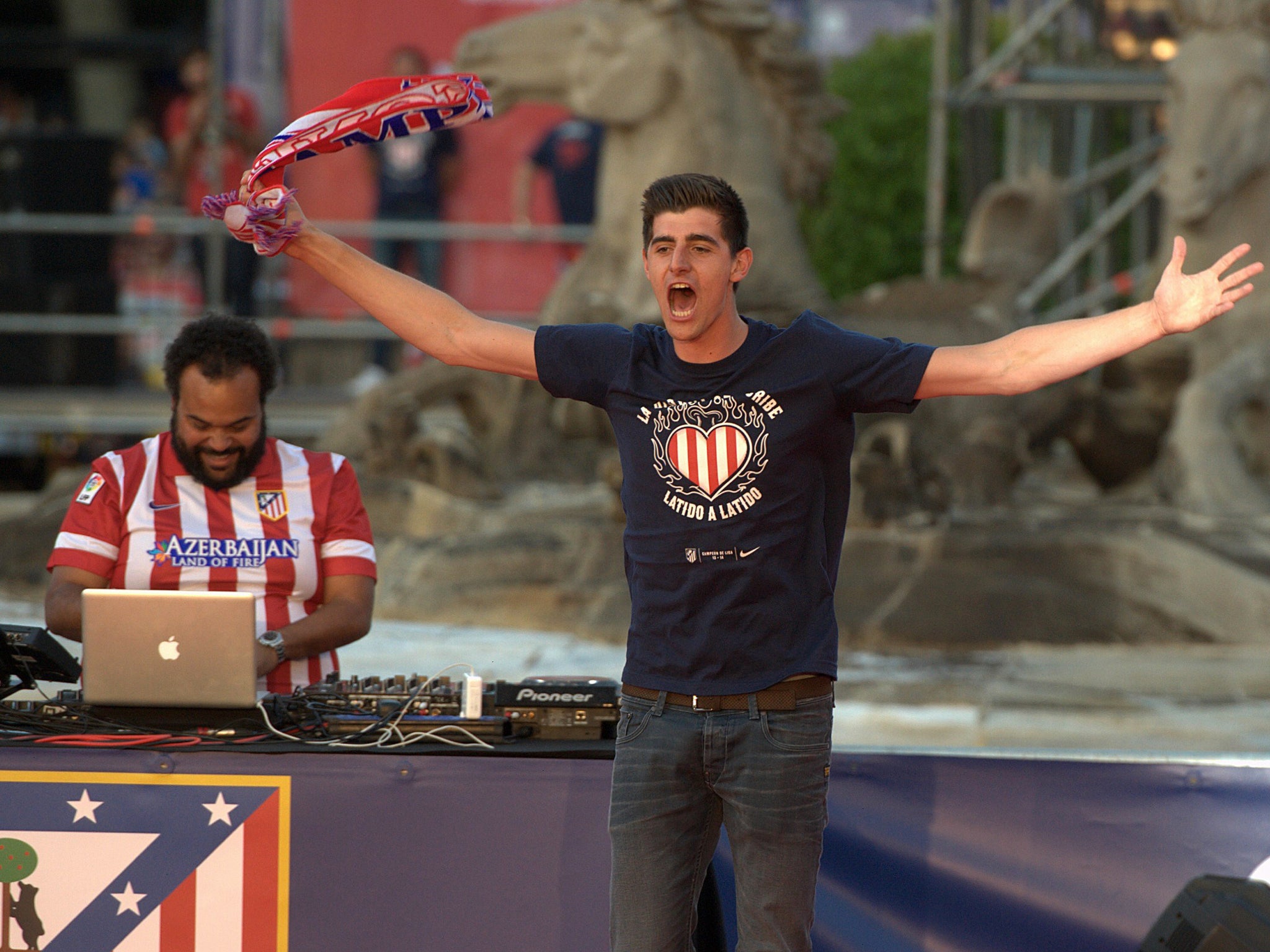 Thibault Courtois celebrates Atletico Madrid's La Liga success during the Madrid bus parade