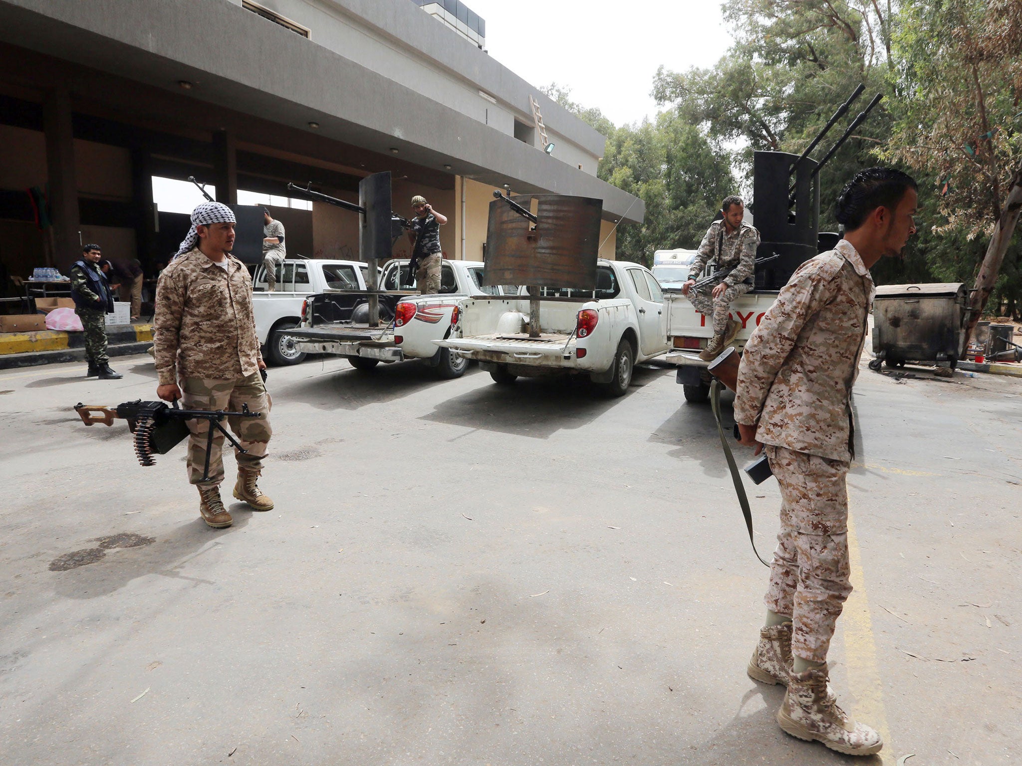 The militiamen are armed with truck-mounted anti-aircraft guns, mortars and rocket-propelled grenade launchers