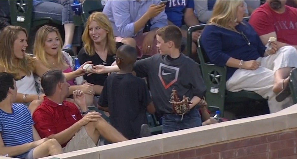 The boy delighted the girls sitting behind him