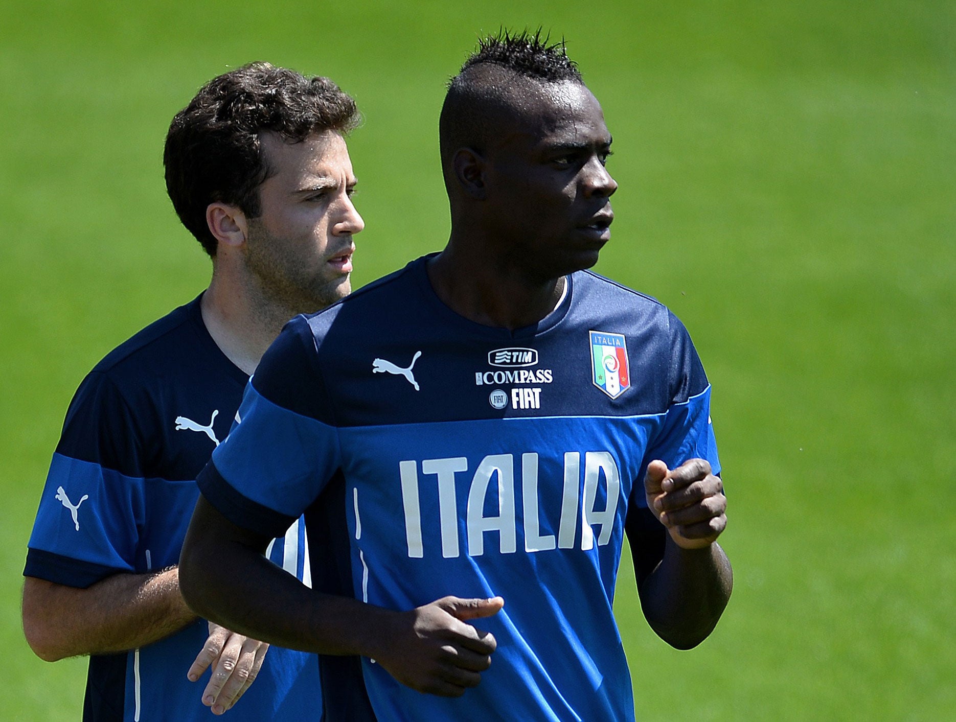 Mario Balotelli (right) trains at the Coverciano training centre today alongside Giuseppe Rossi