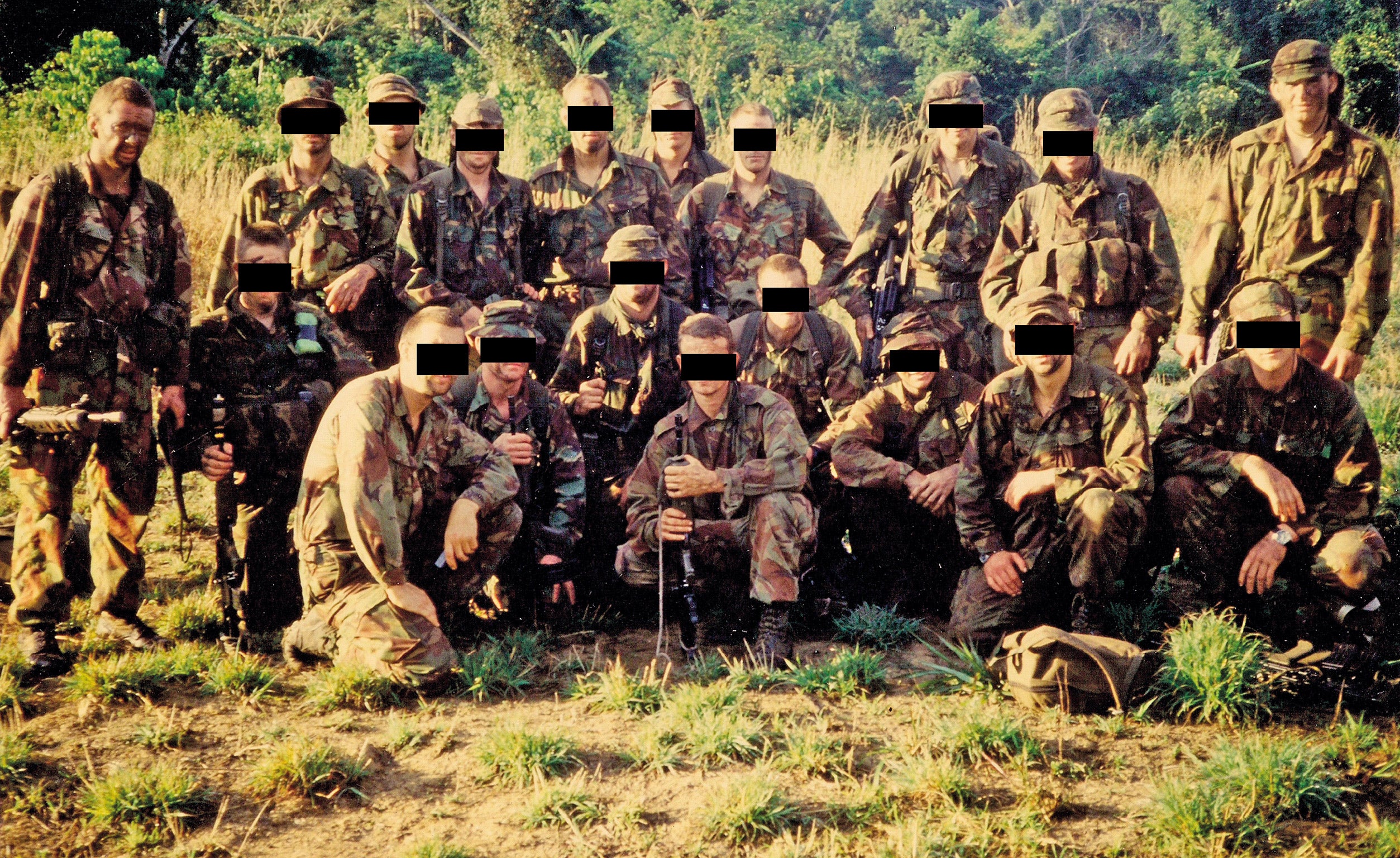 Clear and present danger: the platoon, including Sergeant Steve Heaney (right of picture) and Wag (left)