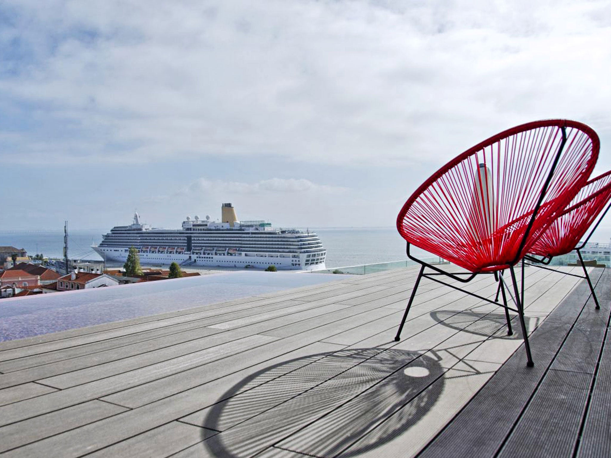 Cruise control: ships come and go below Memmo Alfama