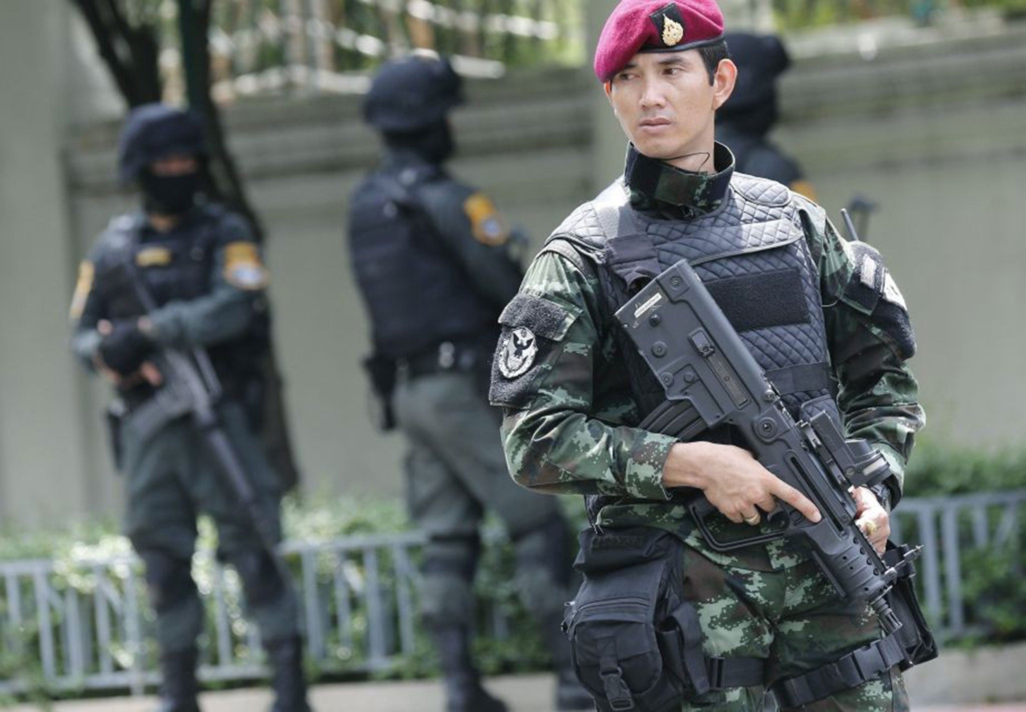 Thai soldiers and police commandos guard the Army Club as the military summons political and protest leaders in Bangkok