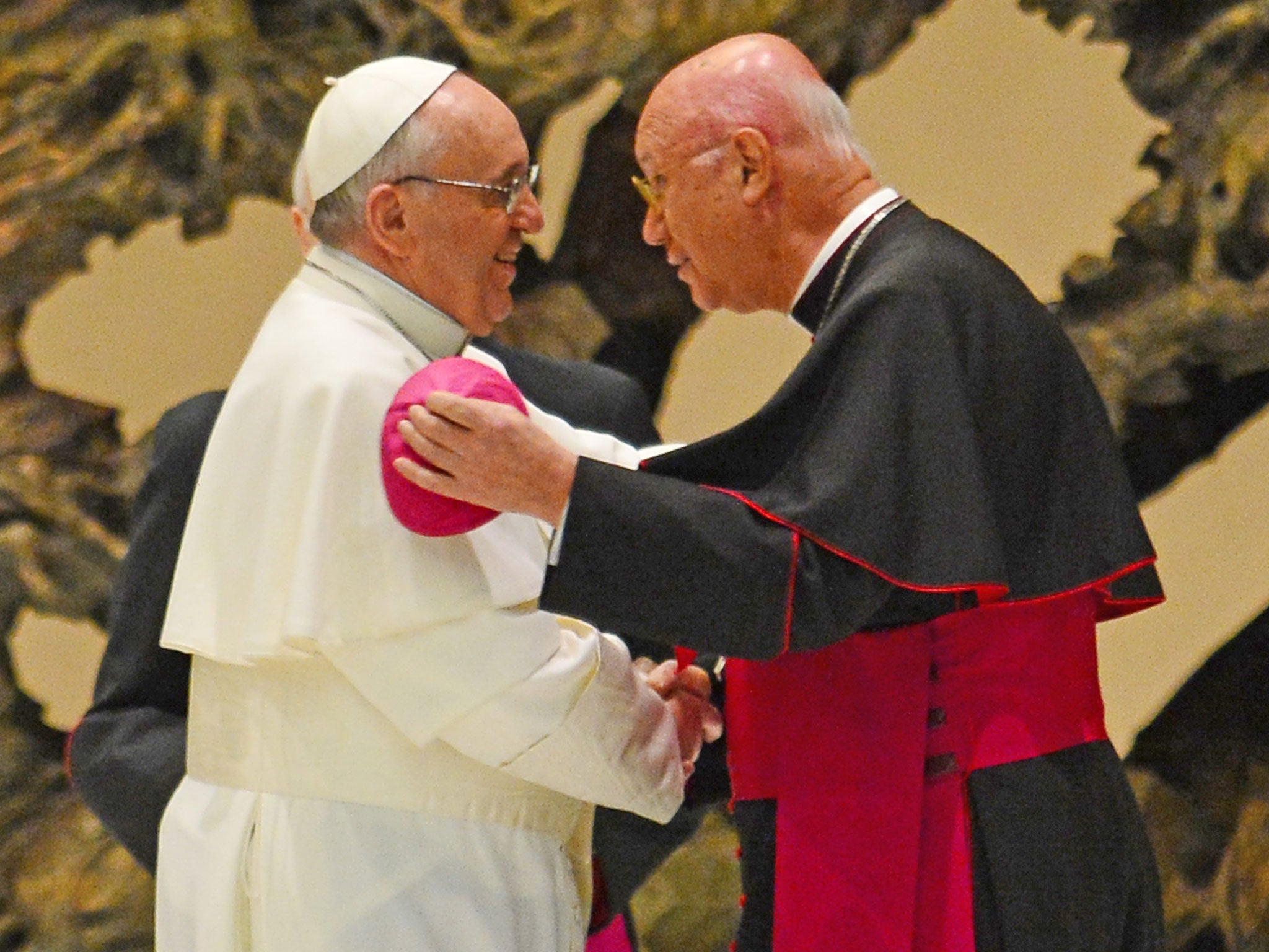 Pope Francis greets the head of the Vatican's pontifical council for social communications, archbishop Claudio Maria Celli