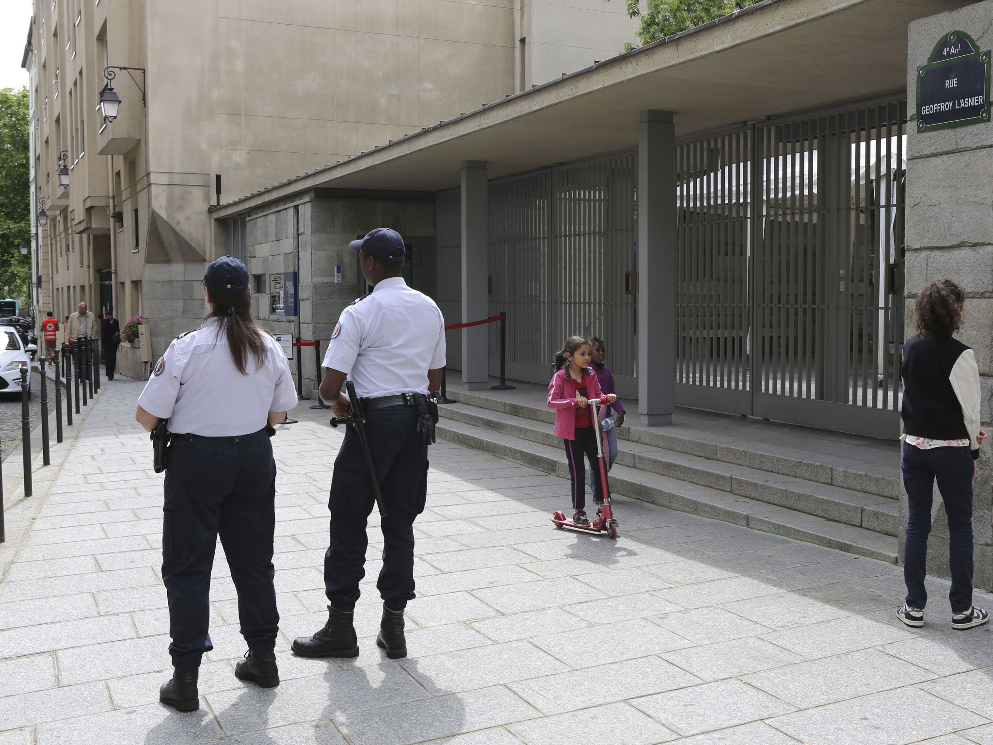 Two police officers stand guard in front of the Shoah Memorial in Paris. French interior minister Bernard Caseneuve ordered police around France to increase security at Jewish houses of worship and other Jewish establishments, according to a statement on