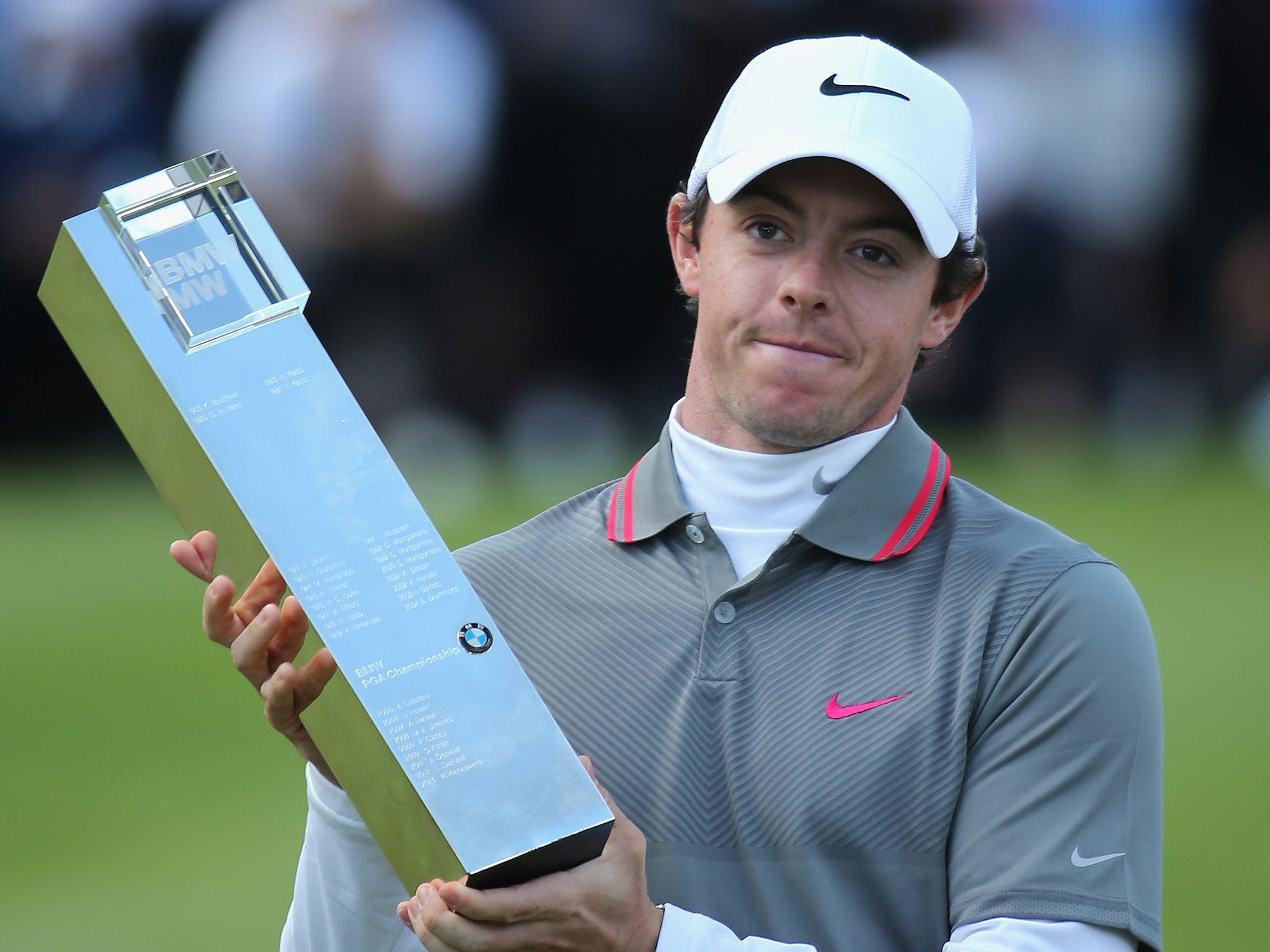 Rory McIlroy poses with the trophy