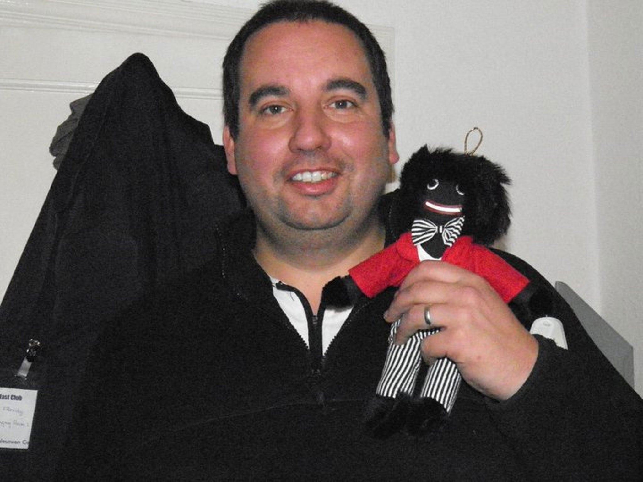 Mr Etheridge posted a picture of himself with a 'golliwog' on Facebook