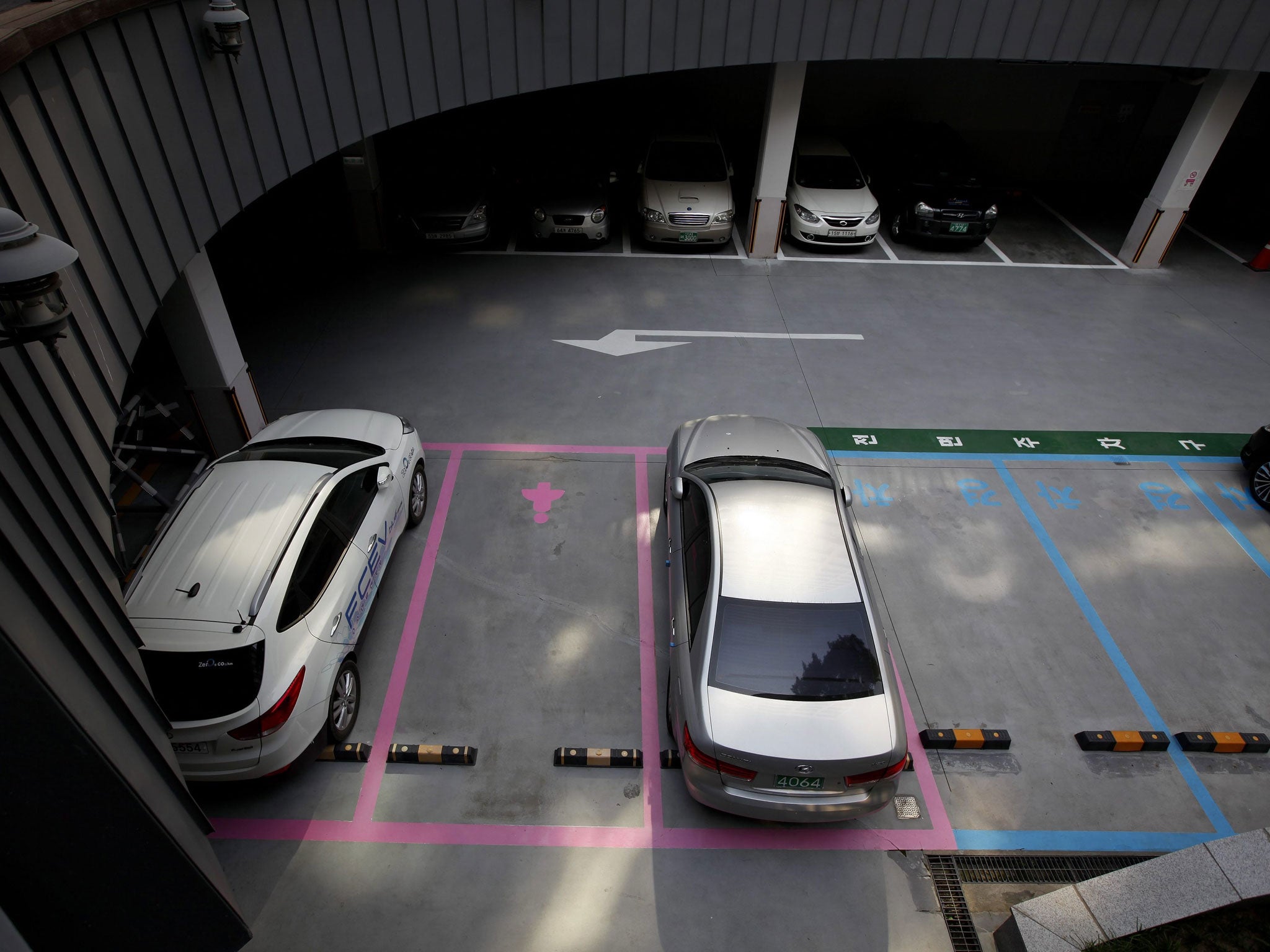 The female parking zones in many places of the South Korean capital were reportedly created as part of a broader movement to boost safety in a 'Women Friendly Seoul' (EPA)