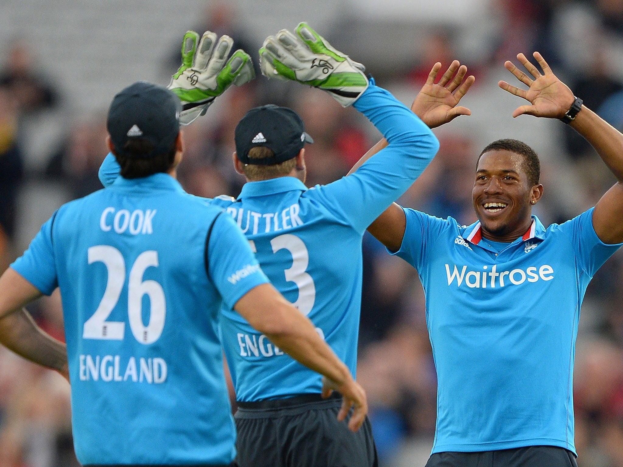 Chris Jordan (R) celebrates after taking the wicket of Sri Lanka's Nuwan Kulasekara during the third One Day International (ODI) cricket match between England and Sri Lanka at Old Trafford