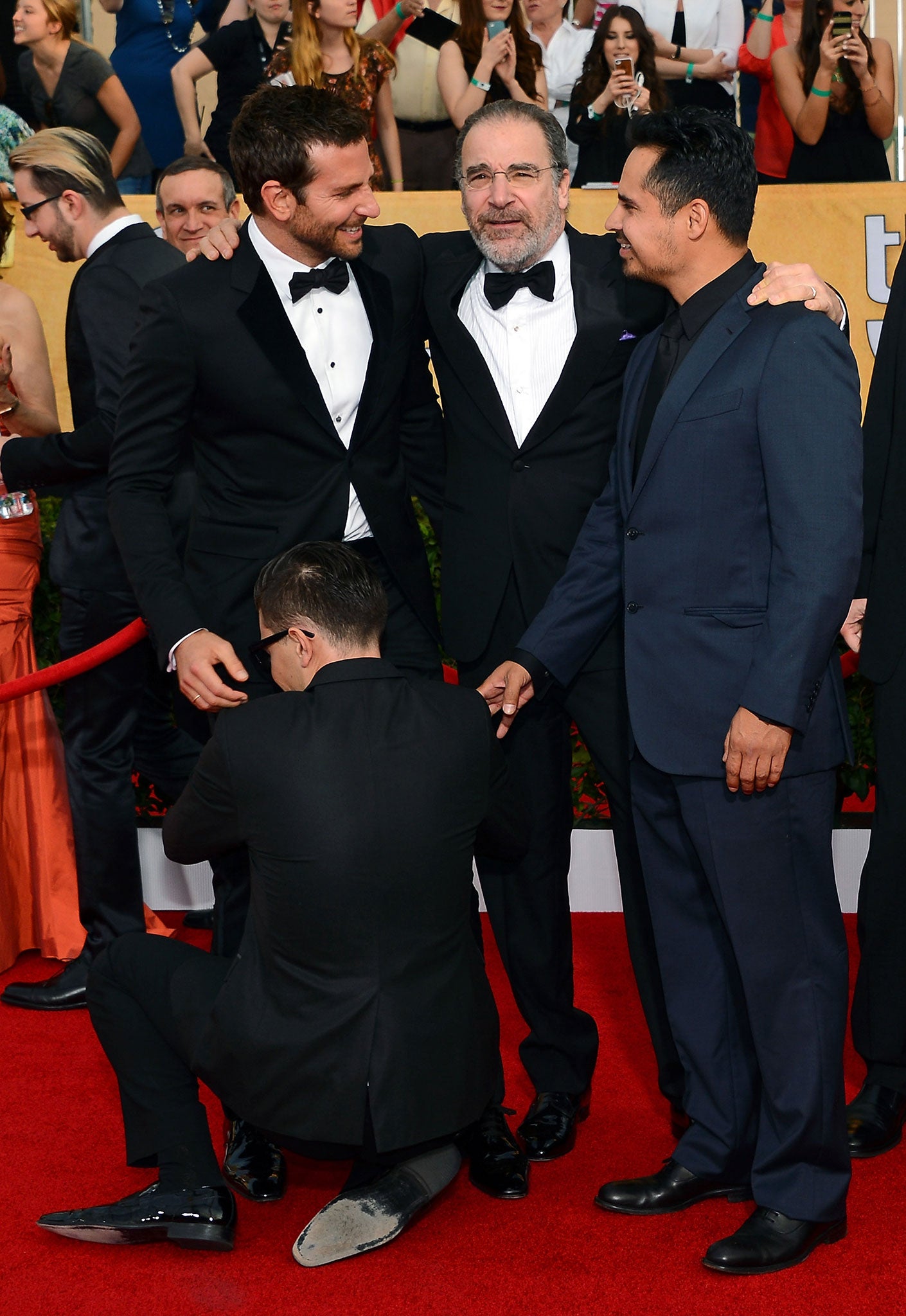 Vitalii Sediuk grabs Bradley Cooper's waist at the SAG Awards in January 2014