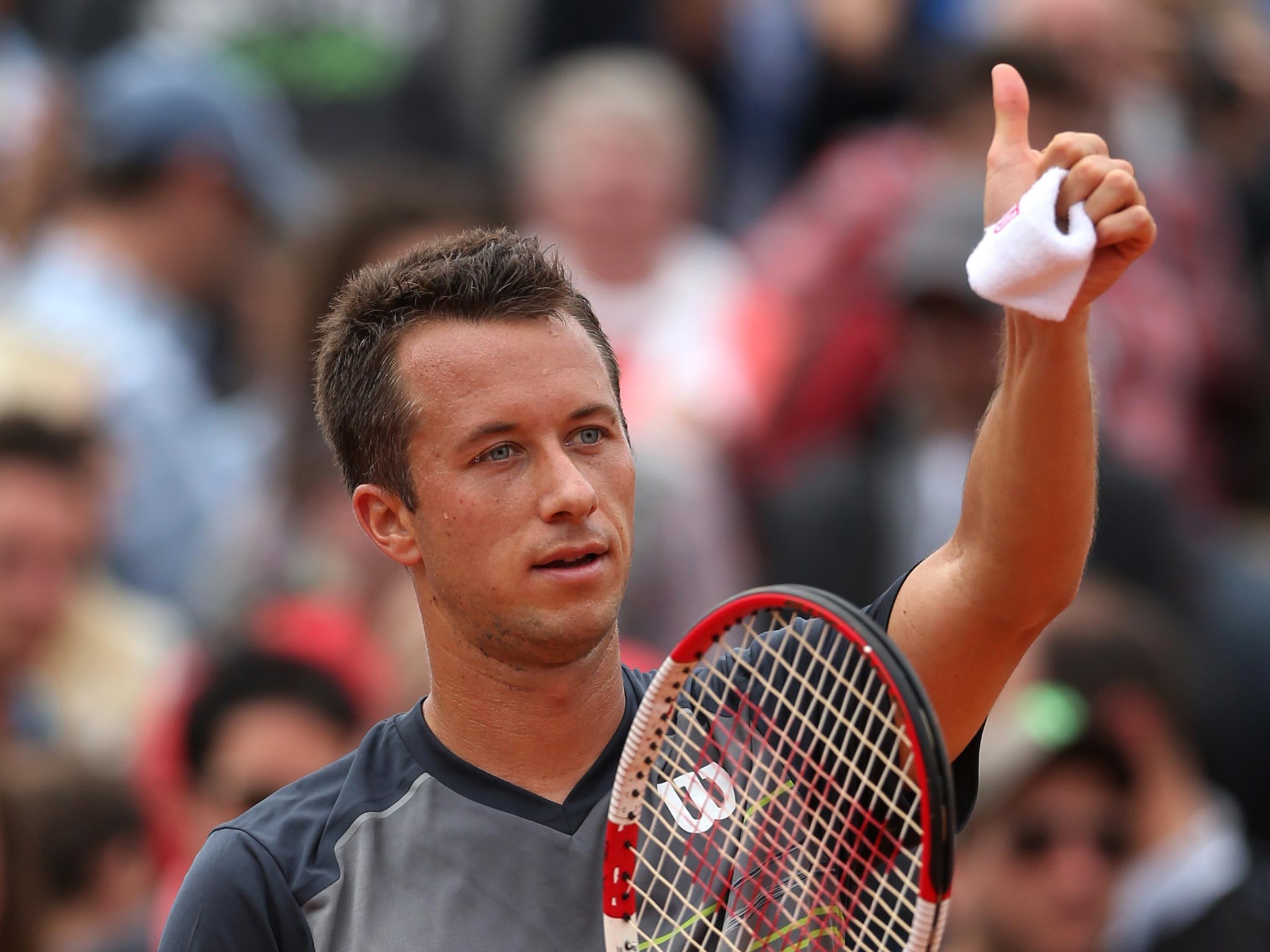 Andy Murray takes on world No 24 Philipp Kohlschreiber (left) in the third round today