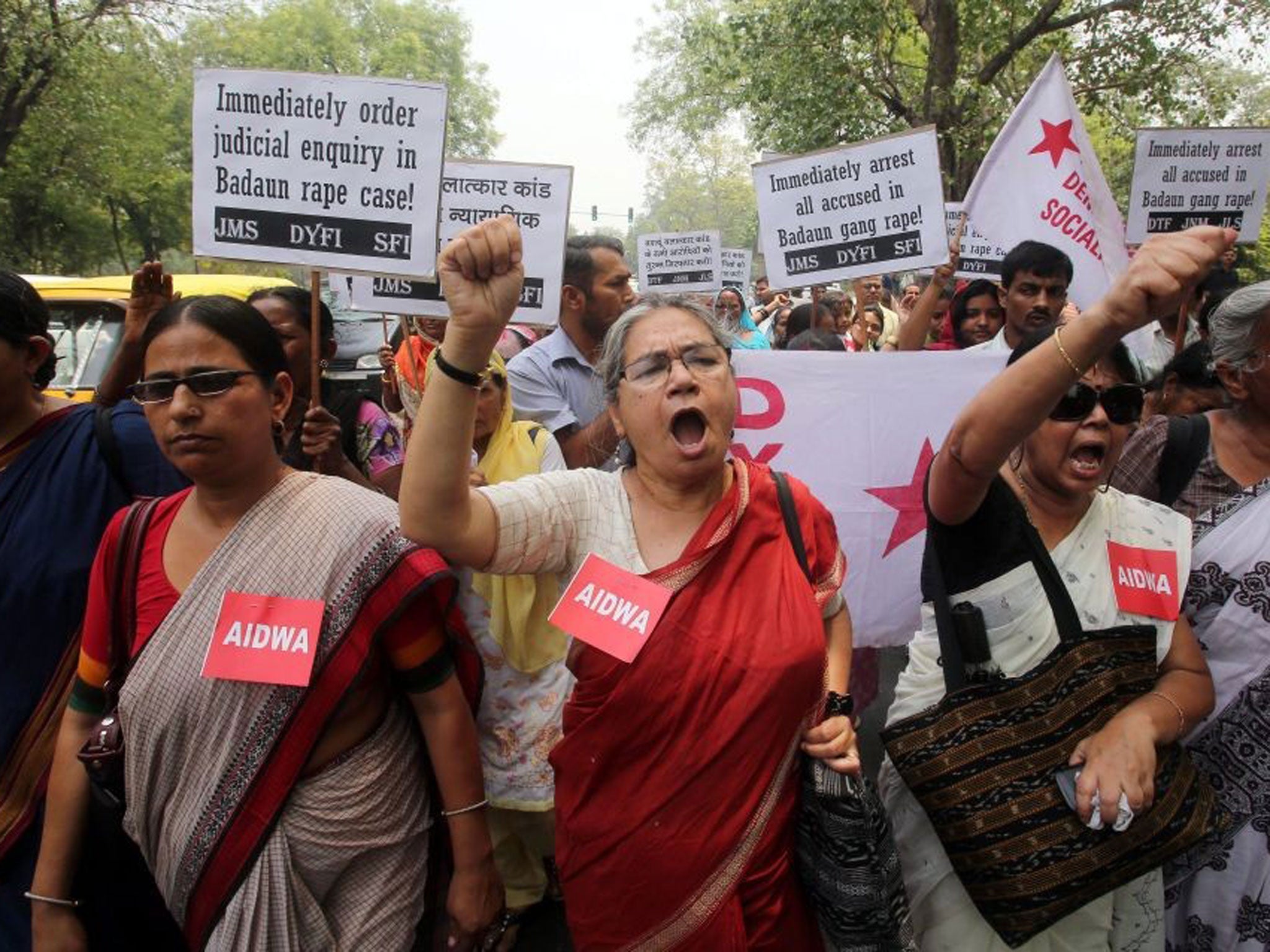 Protesters from various organisations shout slogans against the Uttar Pradesh government during a protest in New Delhi, India, on 31 May, 2014