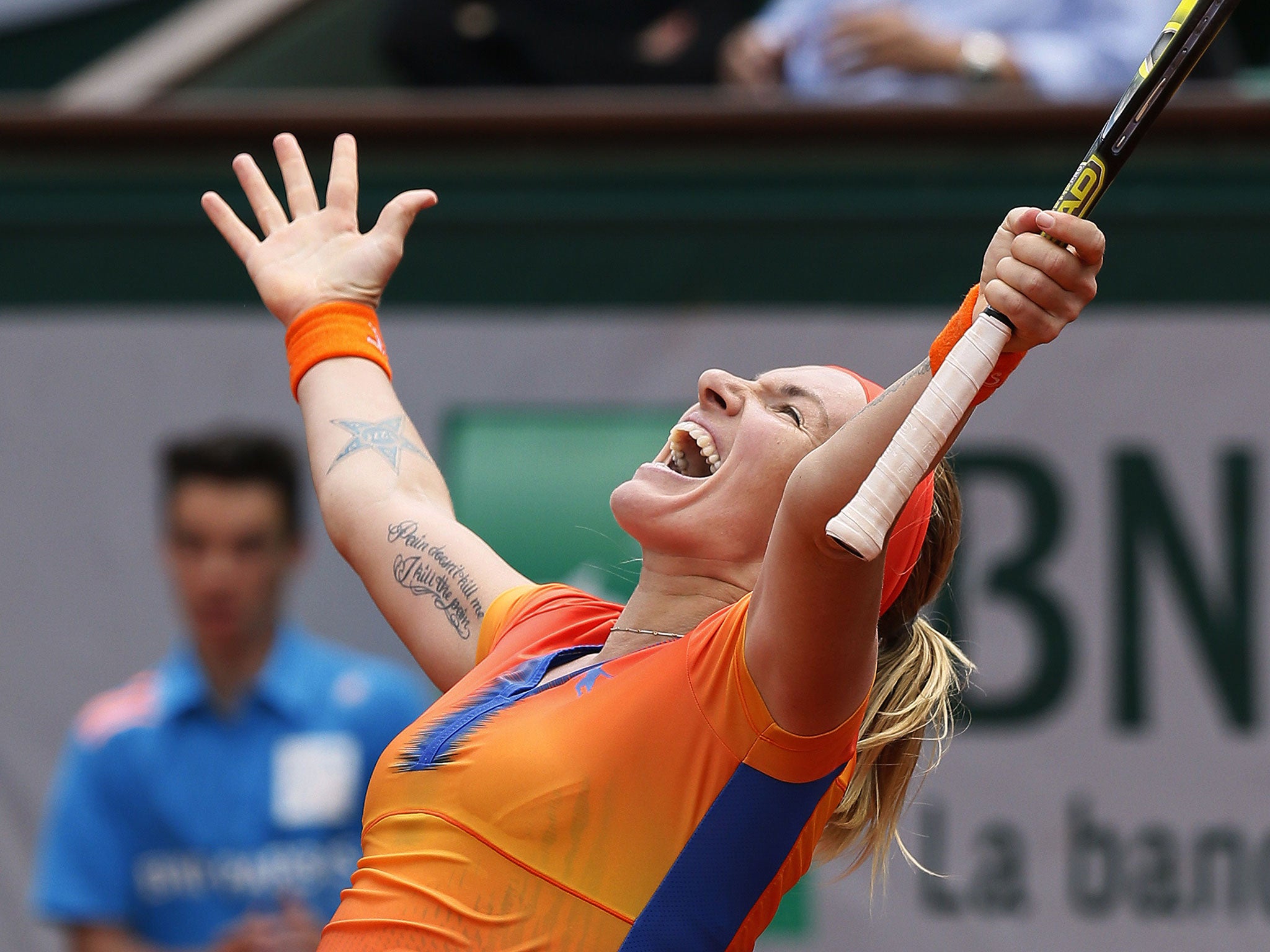 Russia's Svetlana Kuznetsova celebrates her victory over Czech Republic's Petra Kvitova at the end of their French tennis Open third round match at the Roland Garros