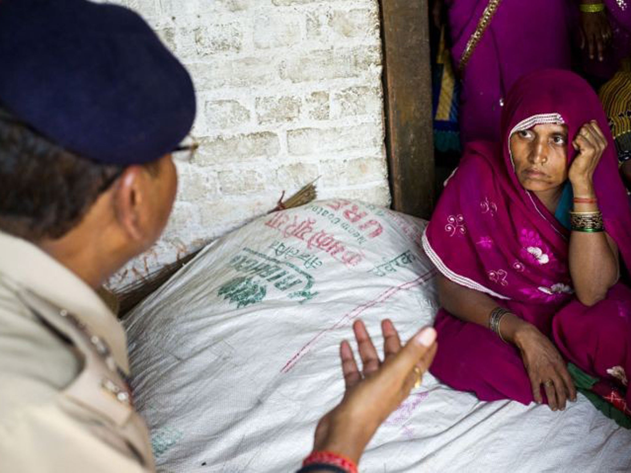 Murti's mother is briefed by the local Senior Superintendant of Police Atul Saxena