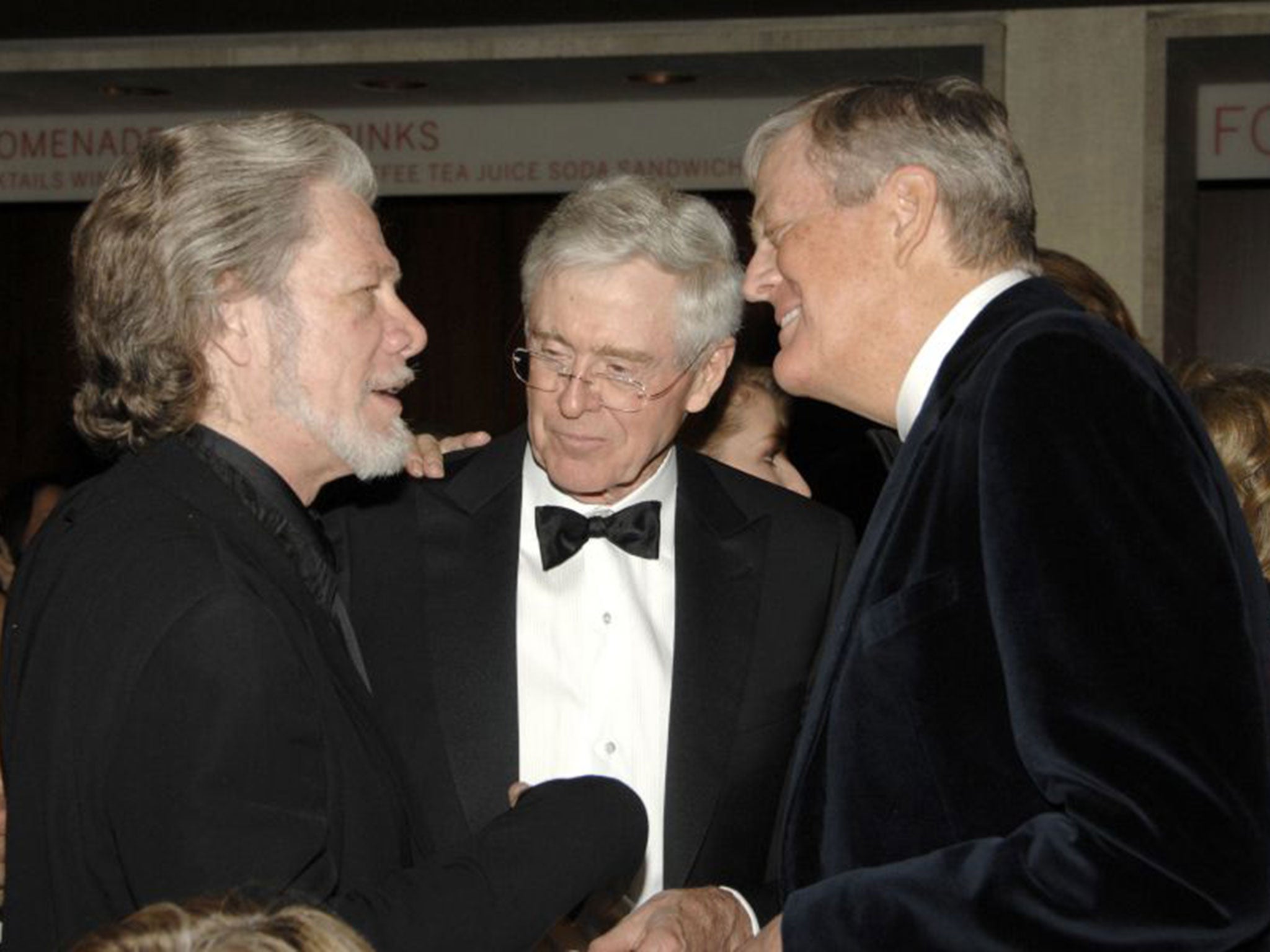 Power brokers: brothers Charles, centre, and David Koch, right, head the family firm