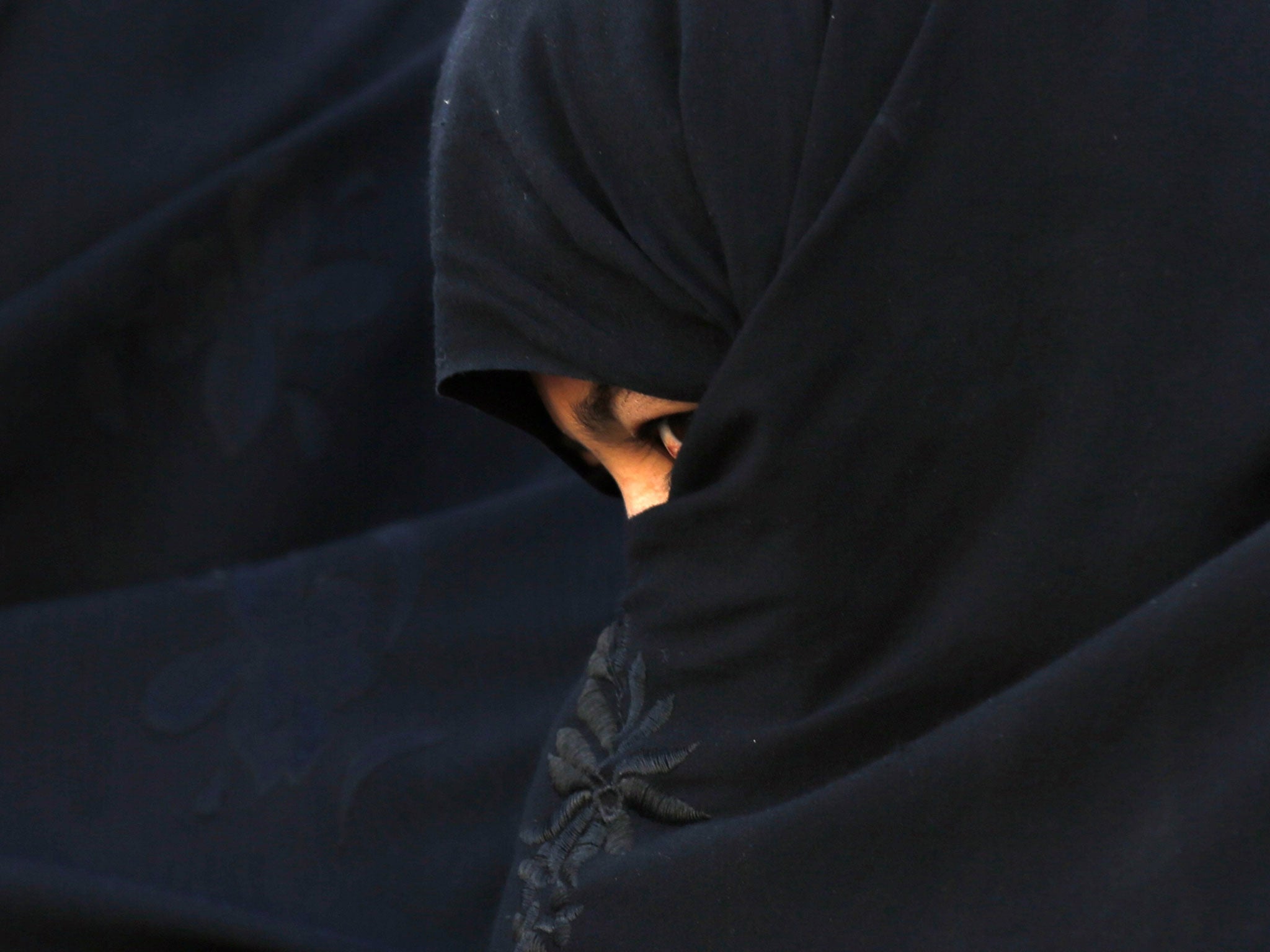 An Afghan woman attends an election campaign of Afghan presidential candidate Abdullah Abdullah in Chaghchran capital of Ghor province