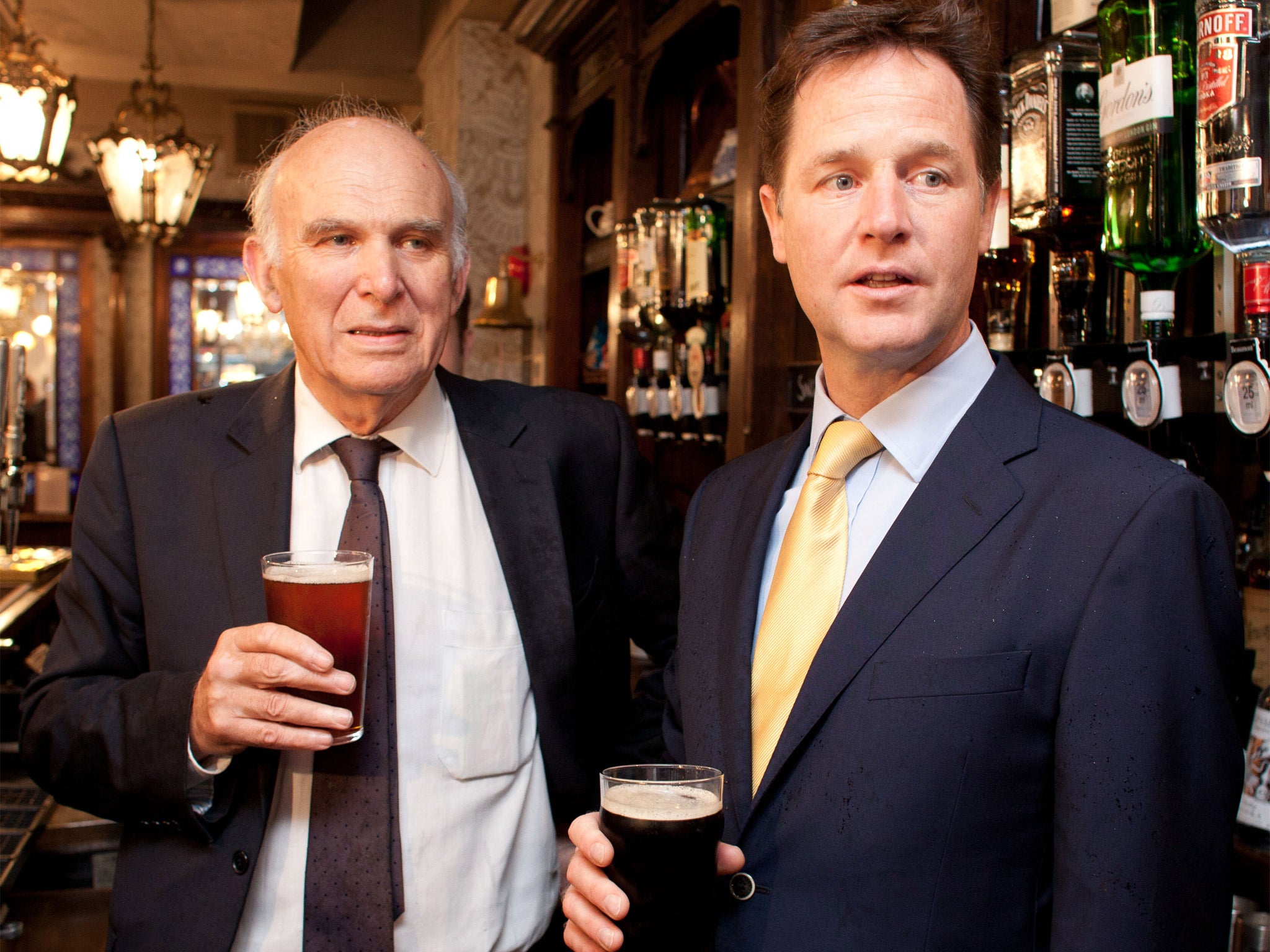 Vince Cable enjoying a Guinness with Lib Dem leader Nick Clegg (Getty)