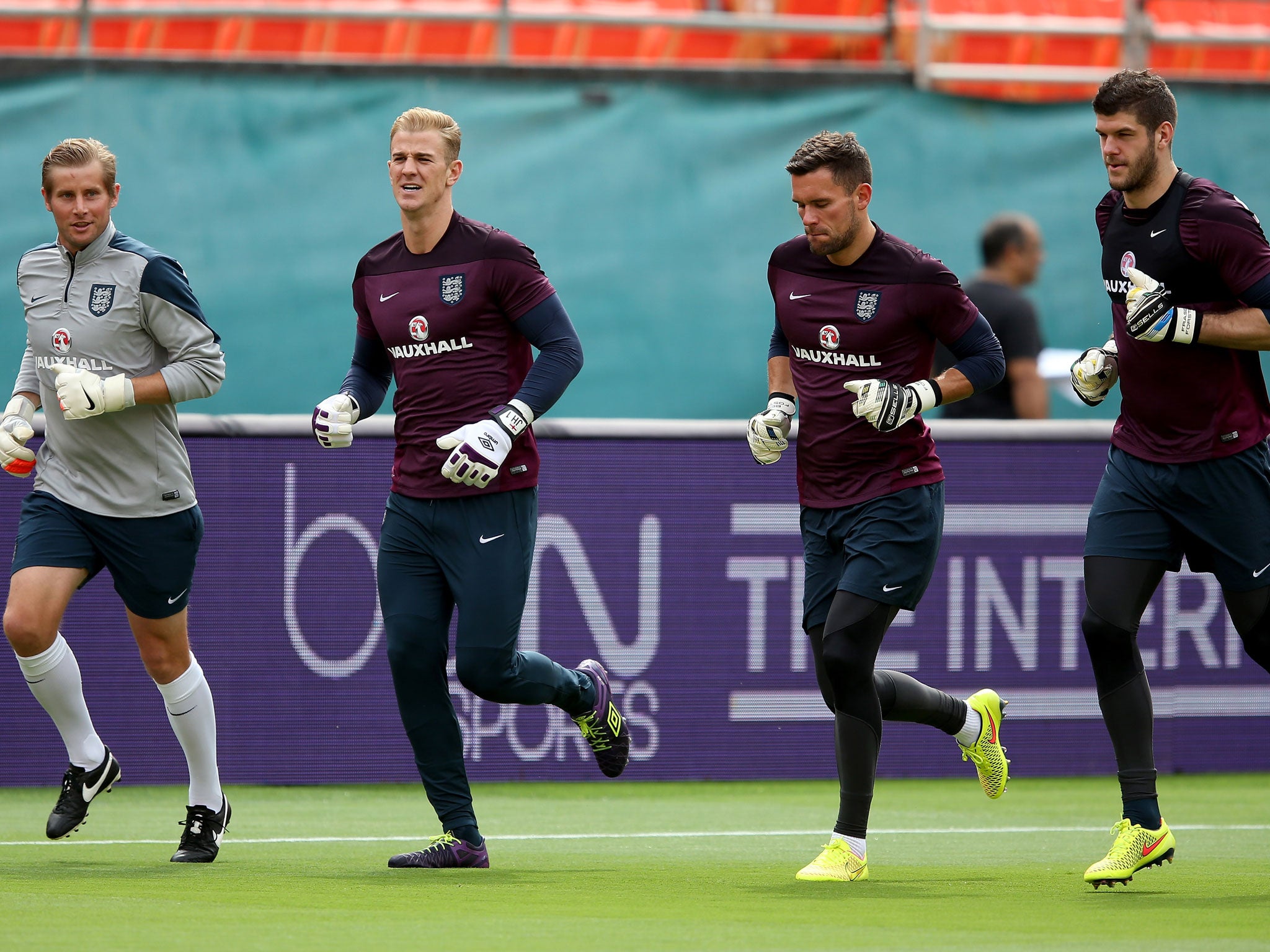 Goalkeepers, Joe Hart, Ben Foster and Fraser Forster warm up during an England training session at The Sunlife Stadium on June 3, 2014 in Miami, Florida.