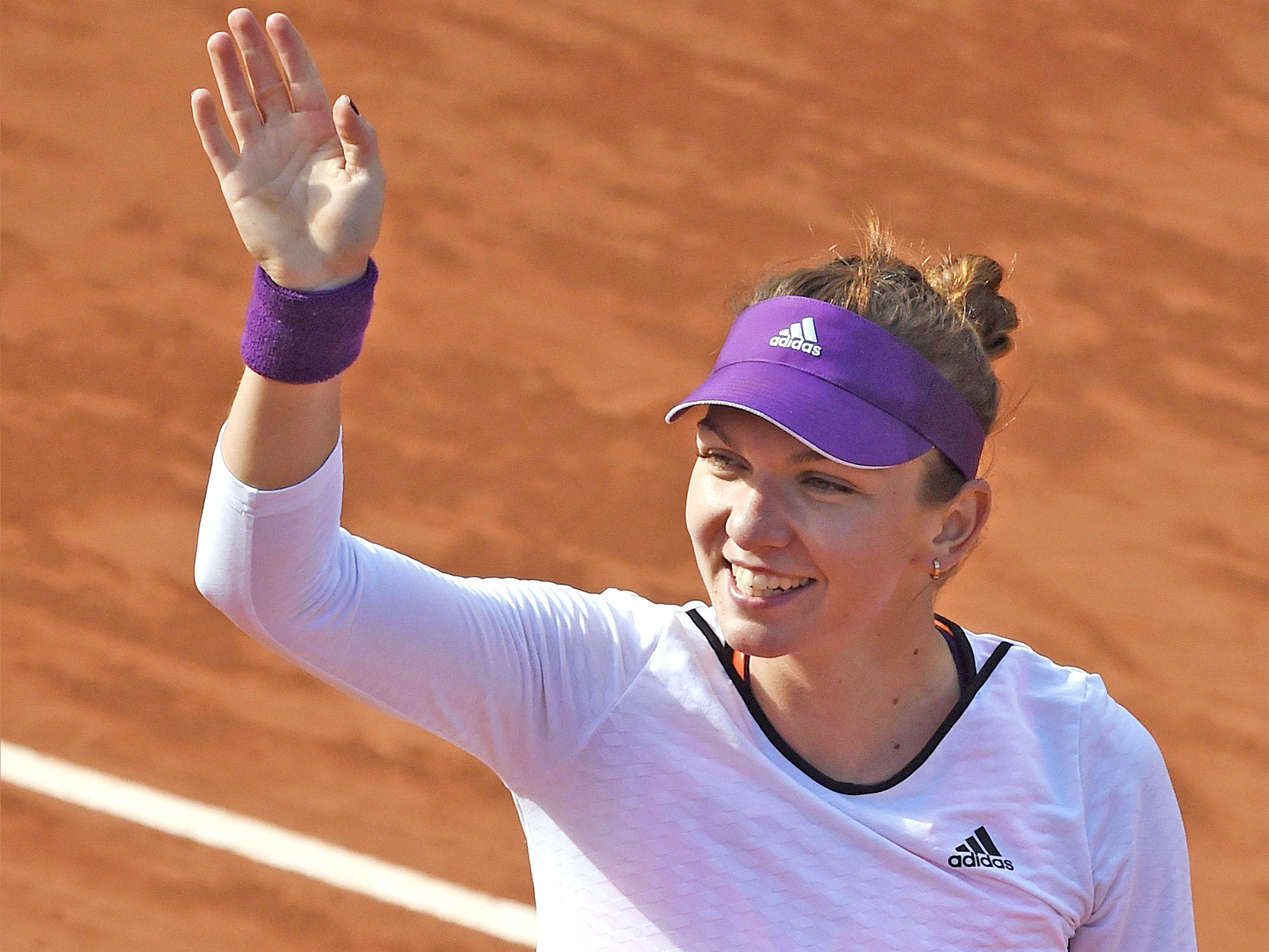 Simona Halep celebrates after beating Svetlana Kuznetsova 6-2, 6-2