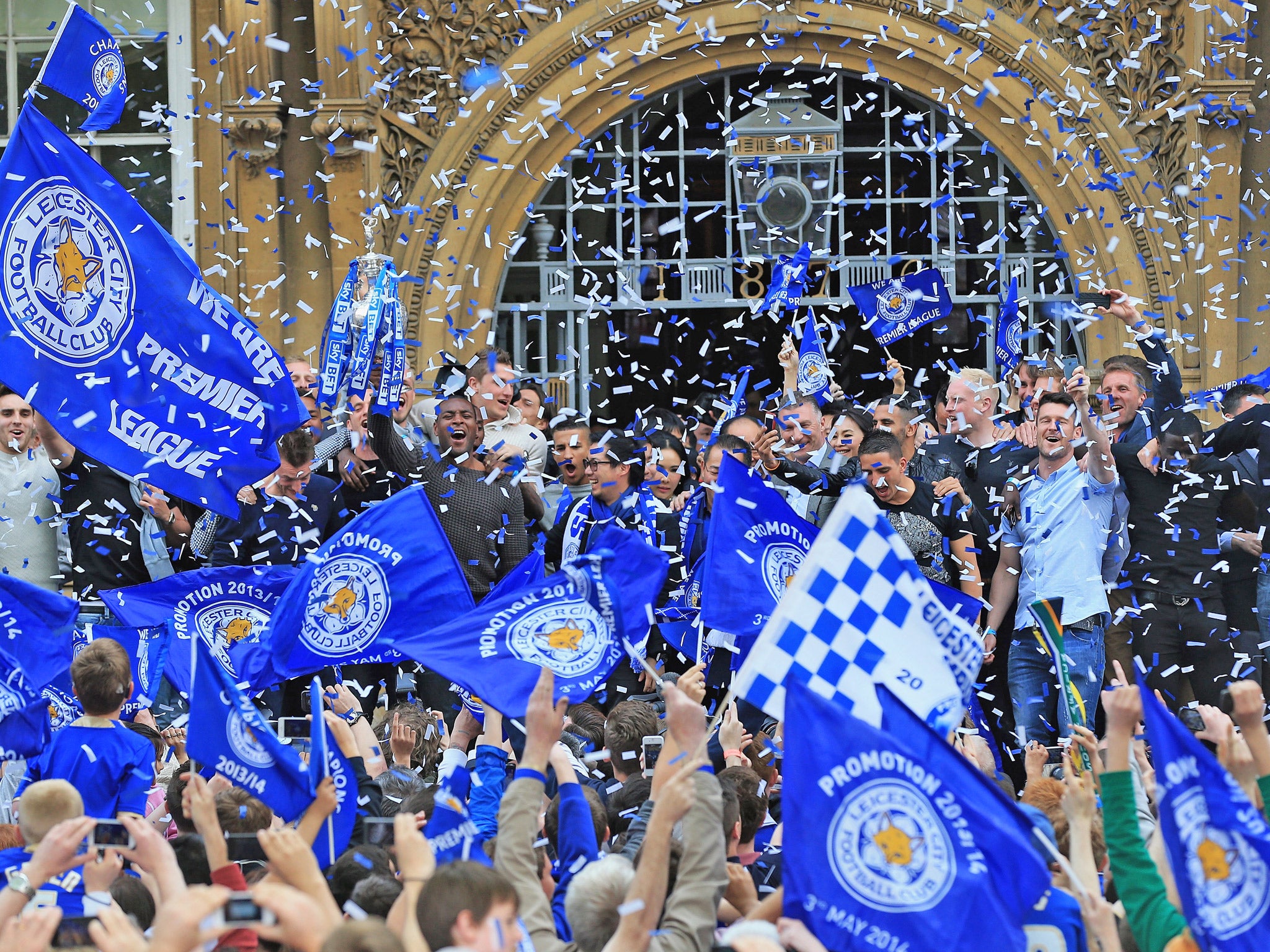 Leicester City celebrate winning the Championship - and with it promotion to the Premier League