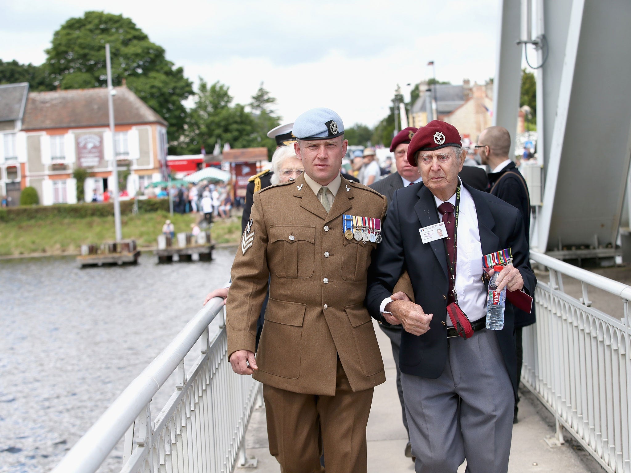 Veterans make their way across Pegasus Bridge during D-Day Commemorations on June 5, 2014 in Ranville, France