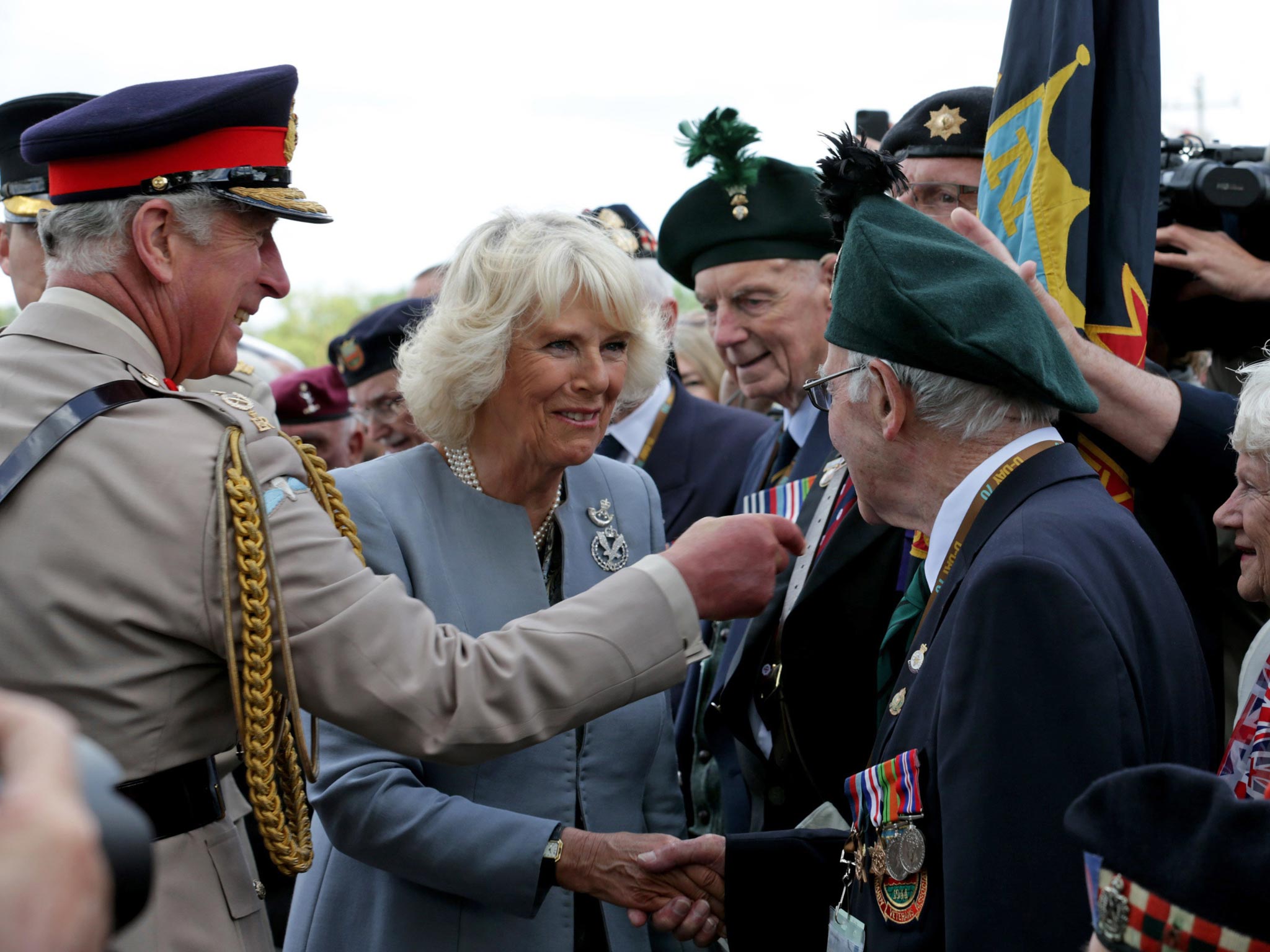 Prince Charles, Prince of Wales and Camilla, Duchess of Cornwall meet with veterans near Pegasus Bridge