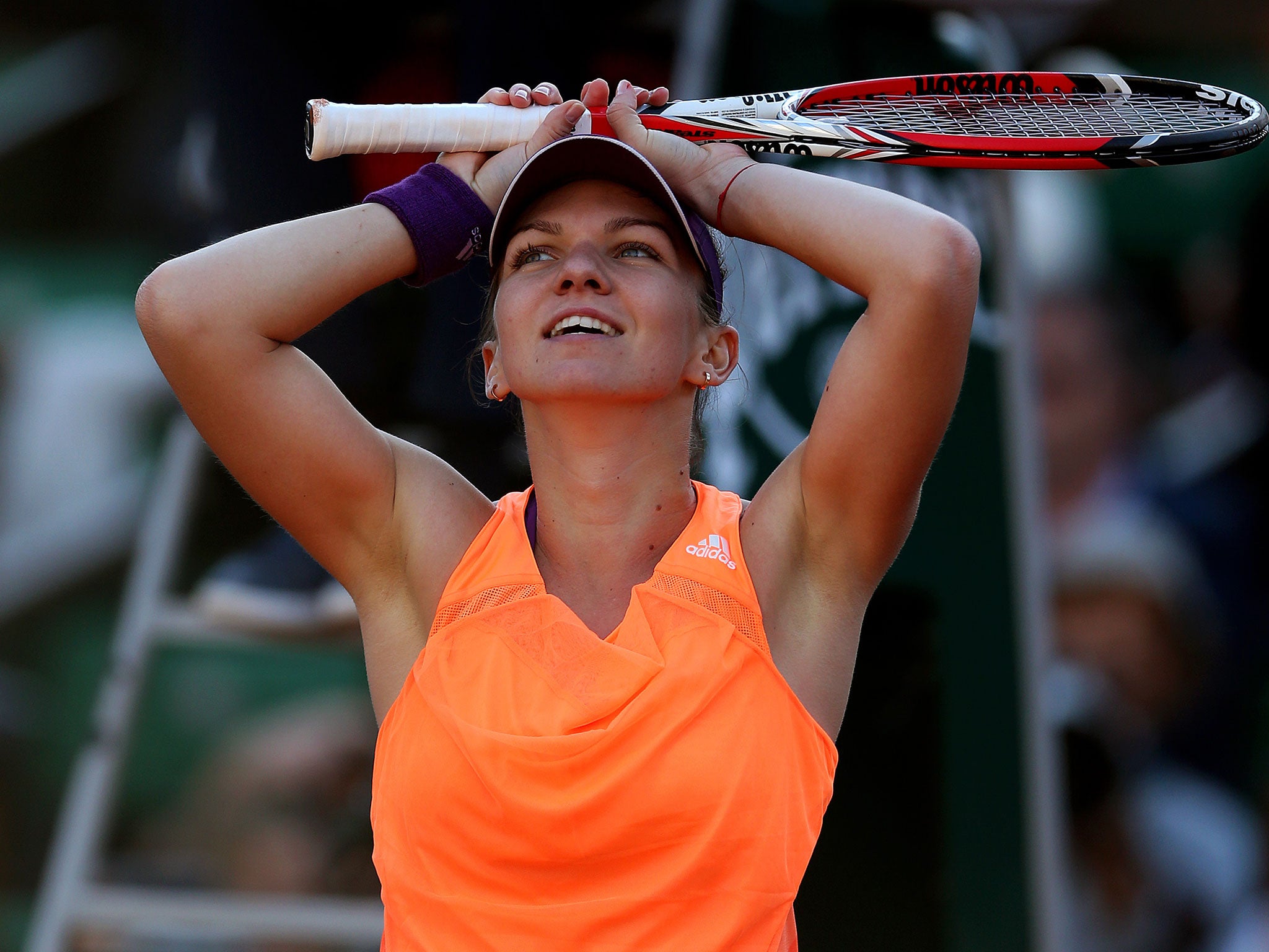 Simona Halep of Romania celebrates victory during her women's semi-final match against Andrea Petkovic of Germany on day twelve of the French Open